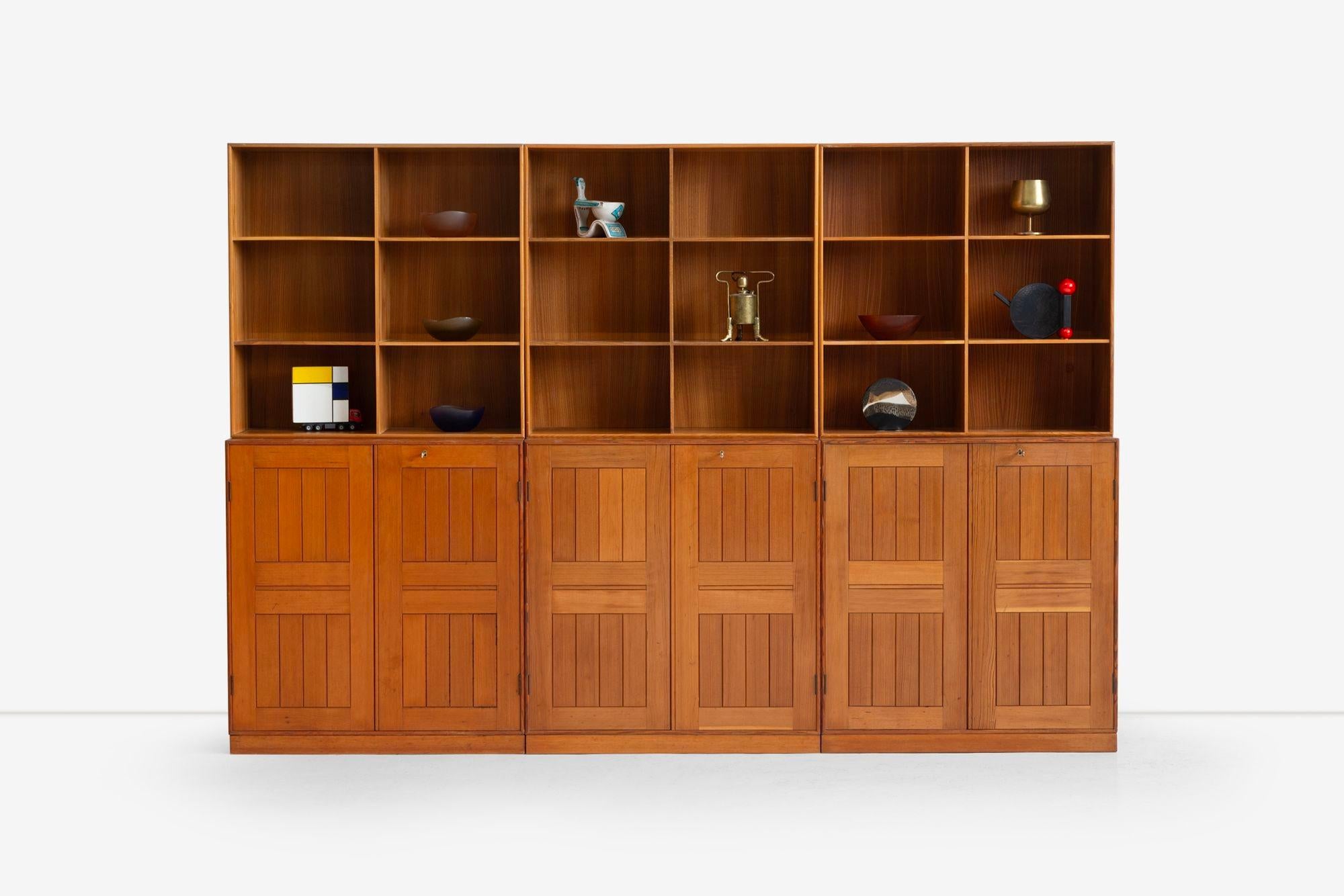 Mogens Koch Cabinets set of Six for Rud Rasmussens Snedkerier, Denmark, 1960.This set consists of three bookcases, each uniquely designed. One cabinet features two doors concealing four small drawers and two larger drawers over four open storage