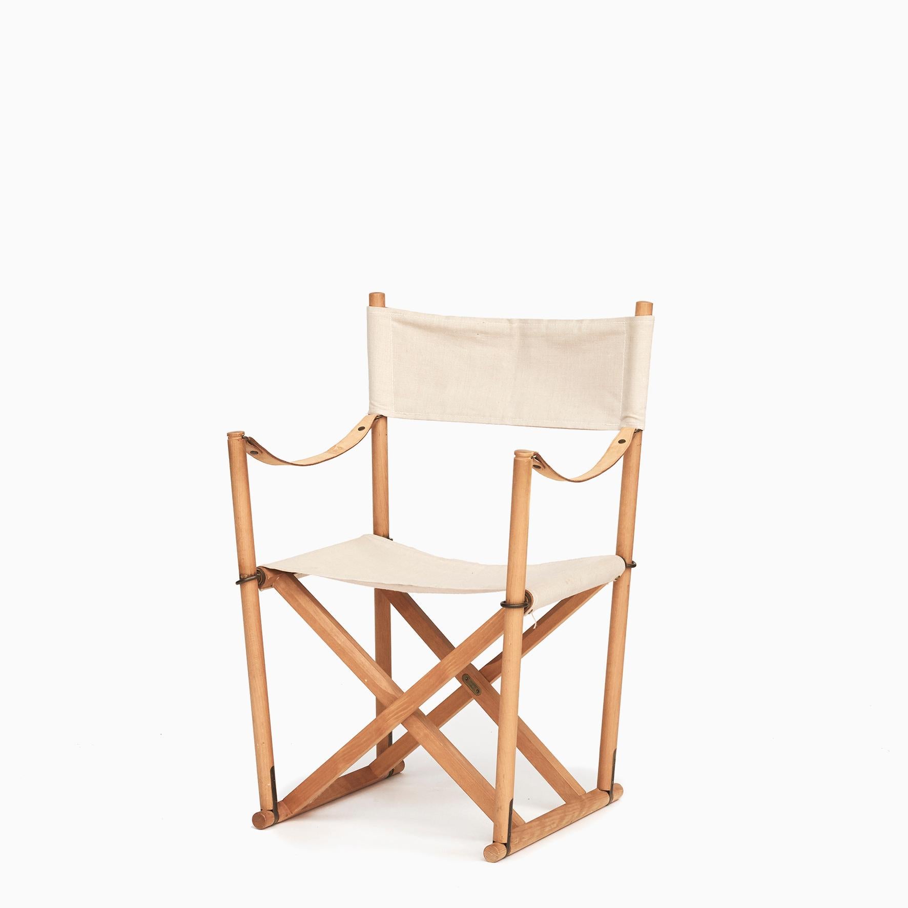 Mogens Koch 1898 - 1992. Folding chair from Cado.
Seat and back of light canvas, arm straps of grain leather.

Designed 1932, Denmark.