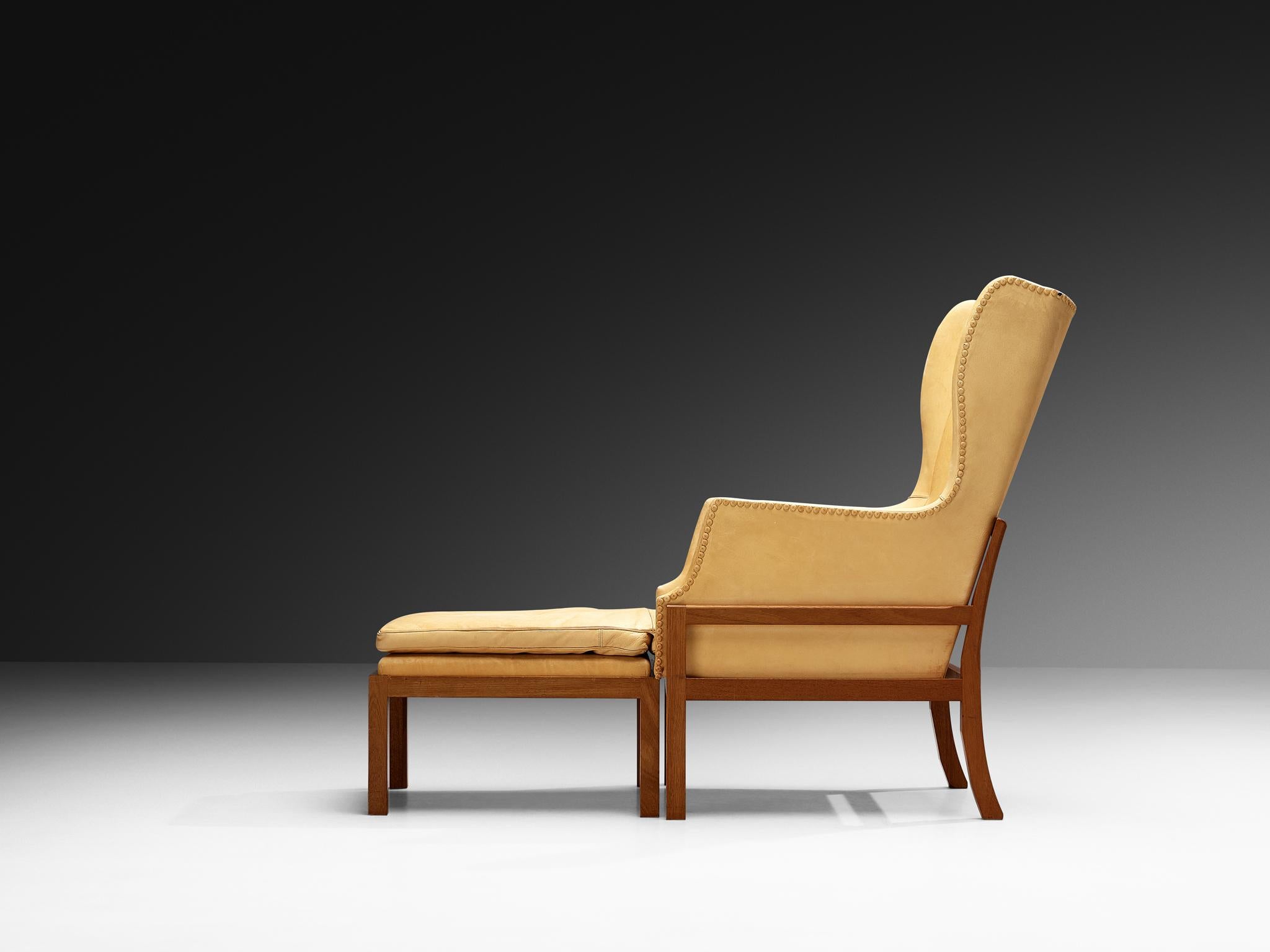 Milieu du XXe siècle Fauteuil à oreilles Fireside de Mogens Koch pour K. Ivan Schlechter avec pouf en vente