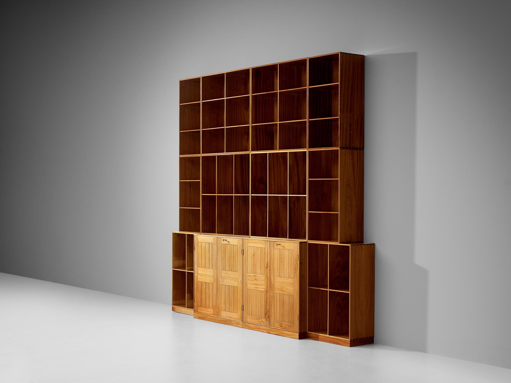 Mogens Koch for Rud Rasmussen, modular book case or library, mahogany, Denmark, 1950s

Intriguing and substantial modular library by Danish designer Mogens Koch. This piece is constructed from different elements to form this great wall unit or