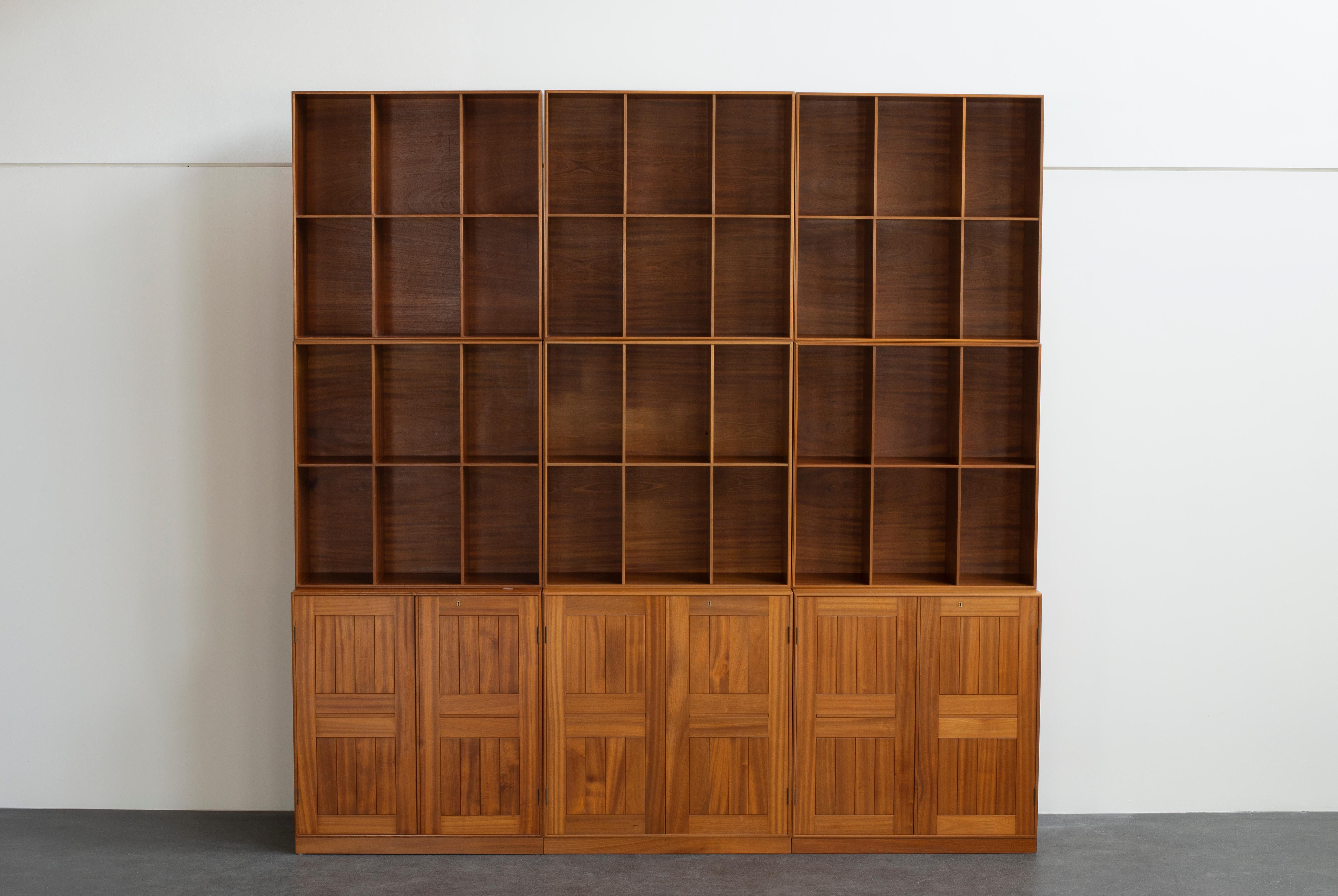 Mogens Koch library in Mahogany. Three cabinets and six bookcases. Executed by Rud Rasmussen.

Reverse with paper labels ‘RUD. RASMUSSENS/SNEDKERIER/KØBENHAVN/DENMARK.