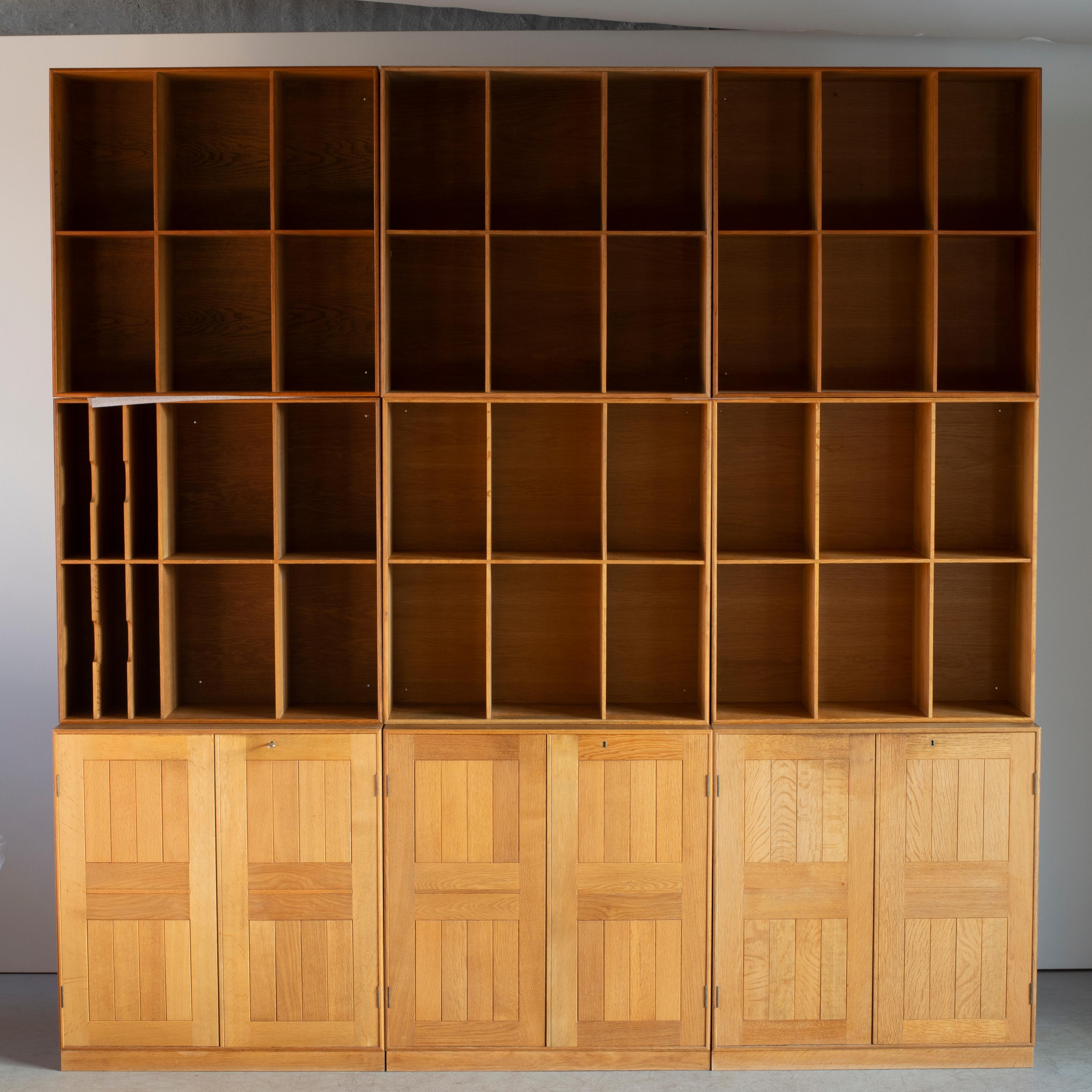 Mogens Koch library in oak. Three cabinets and six bookcases. Executed by Rud Rasmussen.

Reverse with paper labels ‘RUD. RASMUSSENS/SNEDKERIER/KØBENHAVN/DENMARK.