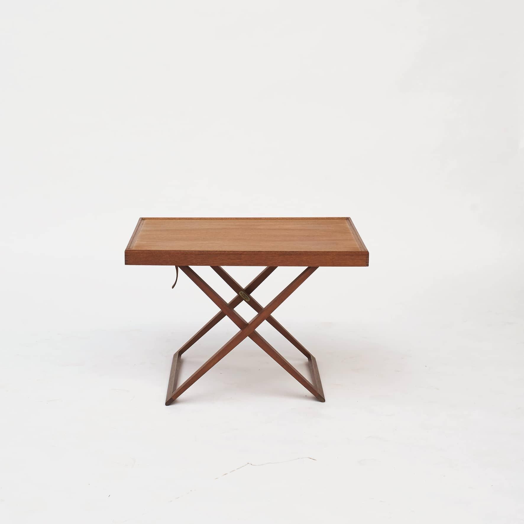 Mogens Koch 1898-1992.
A folding side table designed by Mogens Koch for Interna, Denmark 1960. Made in mahogany.
The folding table can be adjusted to work at two heights to match varying needs. Can also easily be folded together and stoved.