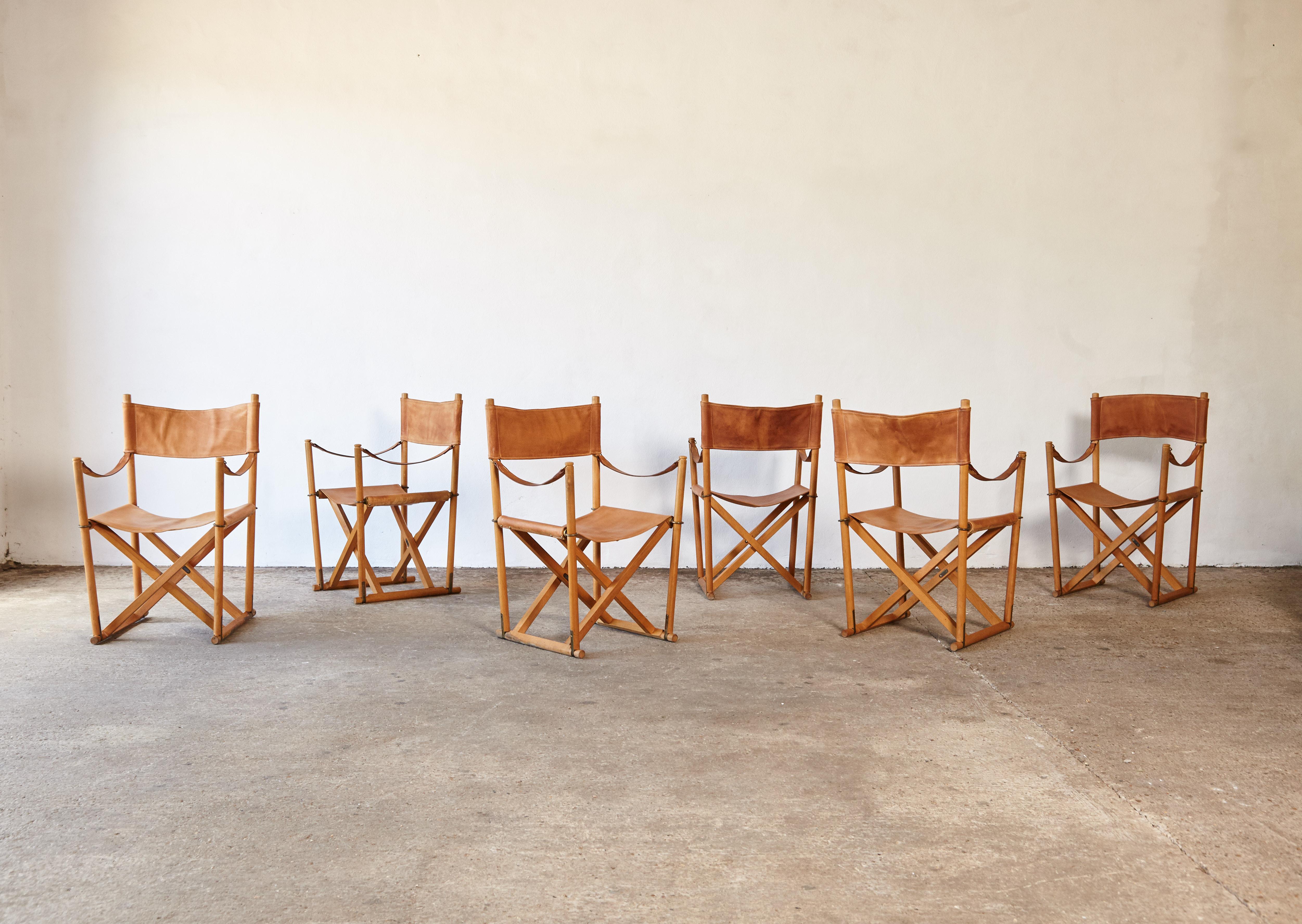 A stunning set of six rare leather Mogens Koch MK-16 folding safari chairs, produced by Rud Rasmussen, Denmark, 1960s. Originally designed in 1932 this chair wasn't produced commercially until the 1960s. The chair has a beech frame with a cognac