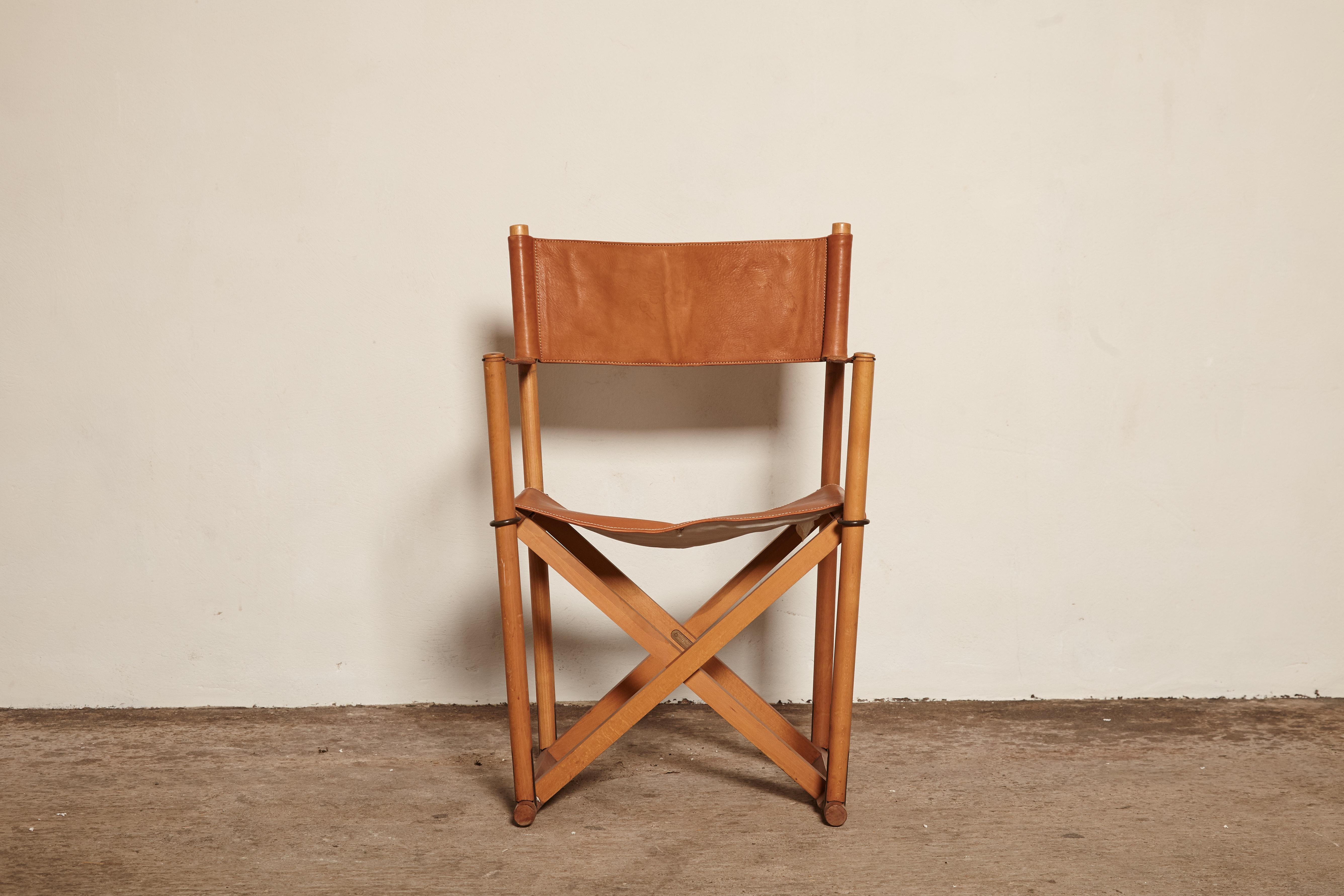 Mogens Koch MK-16 Safari chair for Interna, Denmark, 1960s. Originally designed in 1932 this chair wasn't produced commercially until the 1960s. The chair has a beech frame with a rare cognac leather seat, backrest and armrests. With makers label