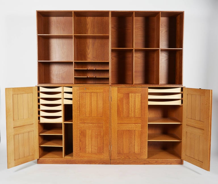 His bookcase was first designed for his own private home and reflected the small rooms in most people's houses that required a flexible bookcase or cabinet. There is an extra base allowing stacking the two bookcases leaving the two cabinets on their