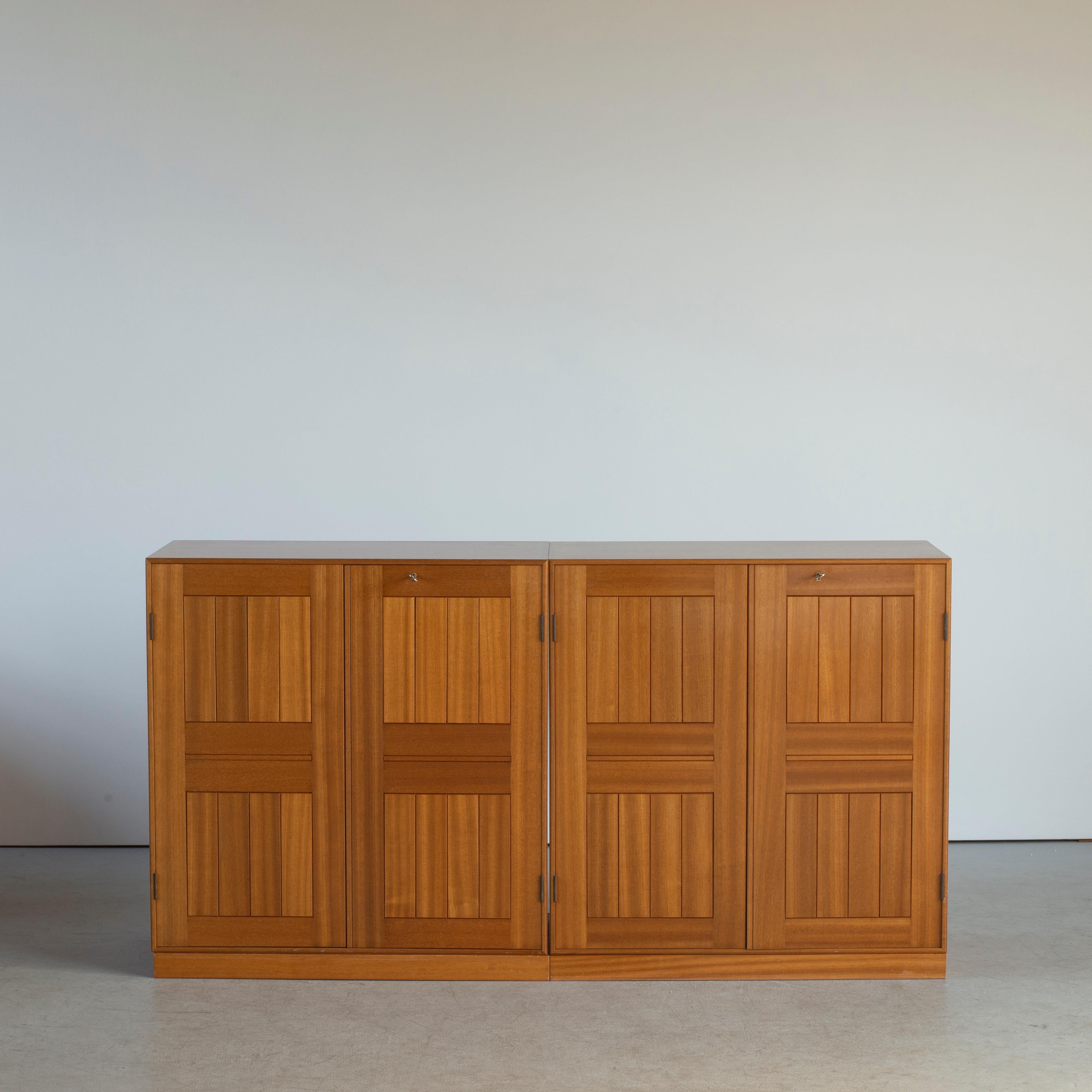 Mogens Koch pair of cabinets in mahogani. Executed by Rud. Rasmussen.

Reverse with paper labels ‘RUD. RASMUSSENS/SNEDKERIER/COPENHAGEN/DENMARK.