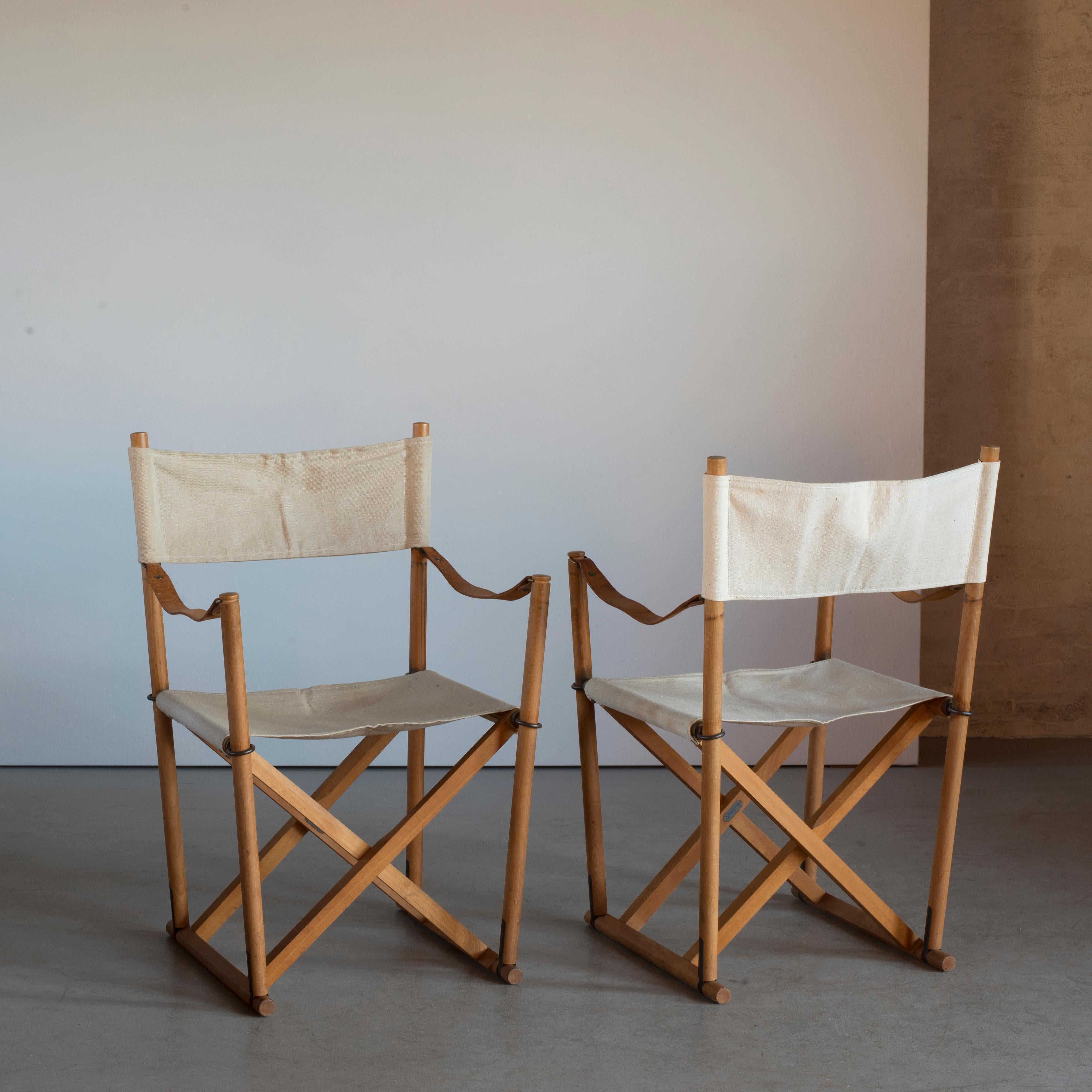 Mogens Koch pair of folding chairs in beech and canvas. Executed by Interna, Denmark.
