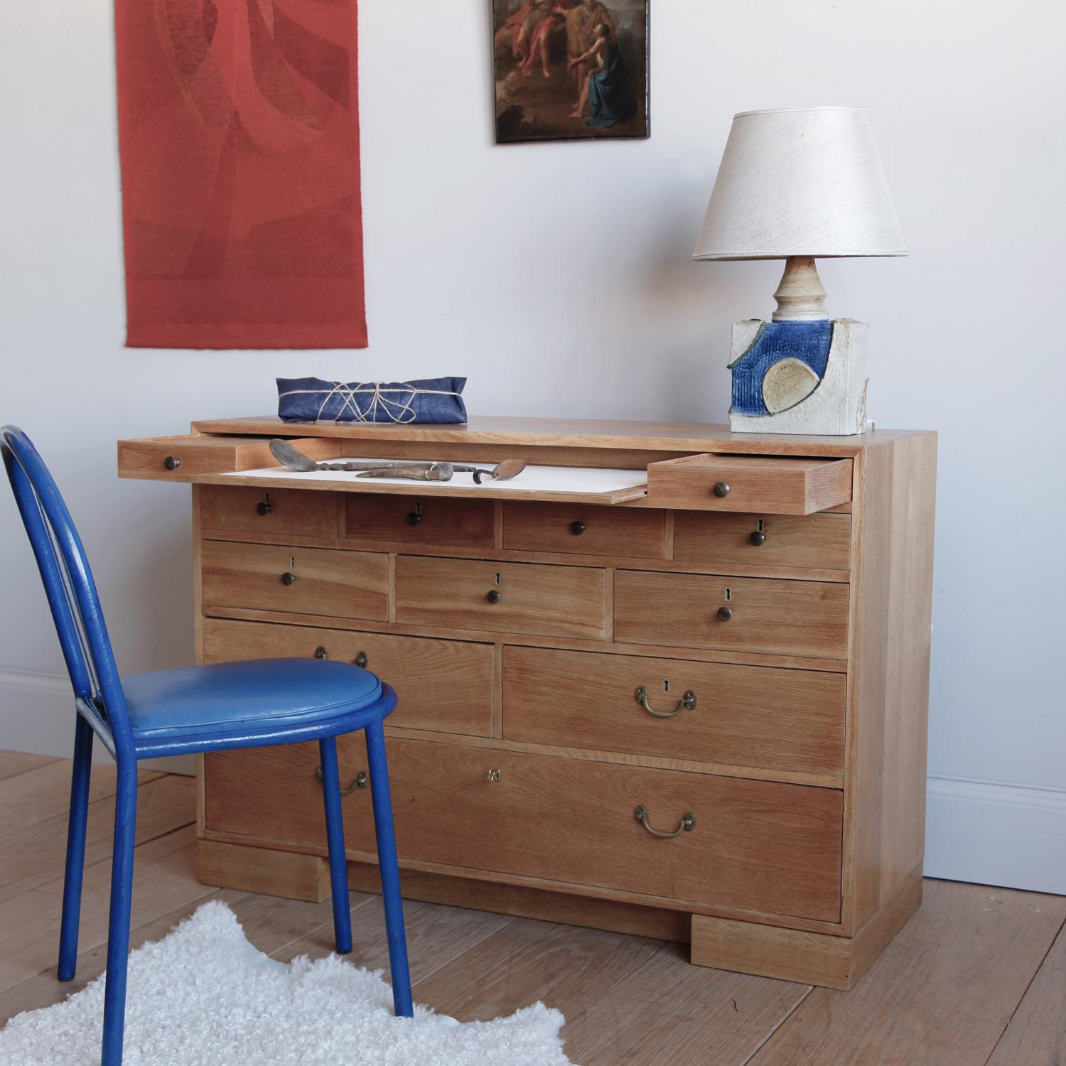 Mogens Koch designed this secretaire for the Sønderborg Statshospital (he also designed the building itself). It was produced in a very limited quantity for the staff there. Oak, with a sliding leather desktop. A beautifully made case piece in