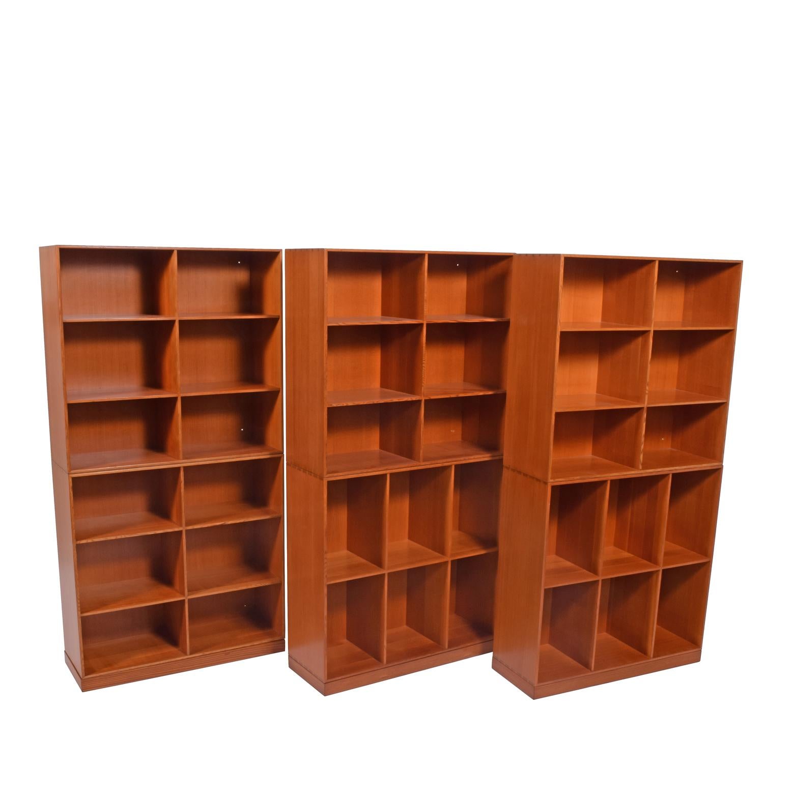 A Danish Classic. Solid Oregon pine, six open bookcases, all with manufacturing label on the back. Each bookcase is separate and can be rearranged as desired. Rud Rasmussen originally designed in the 1920s.

Measure: Each cabinet 29.75