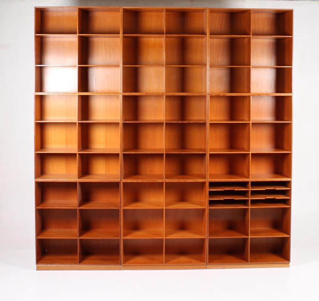 Set of nine square bookcases in Oregon pine designed by Mogens Koch for Rud. Rasmussen cabinetmakers in 1933. Makes a very nice wall or can be used separately. Made in Denmark and in all original condition.