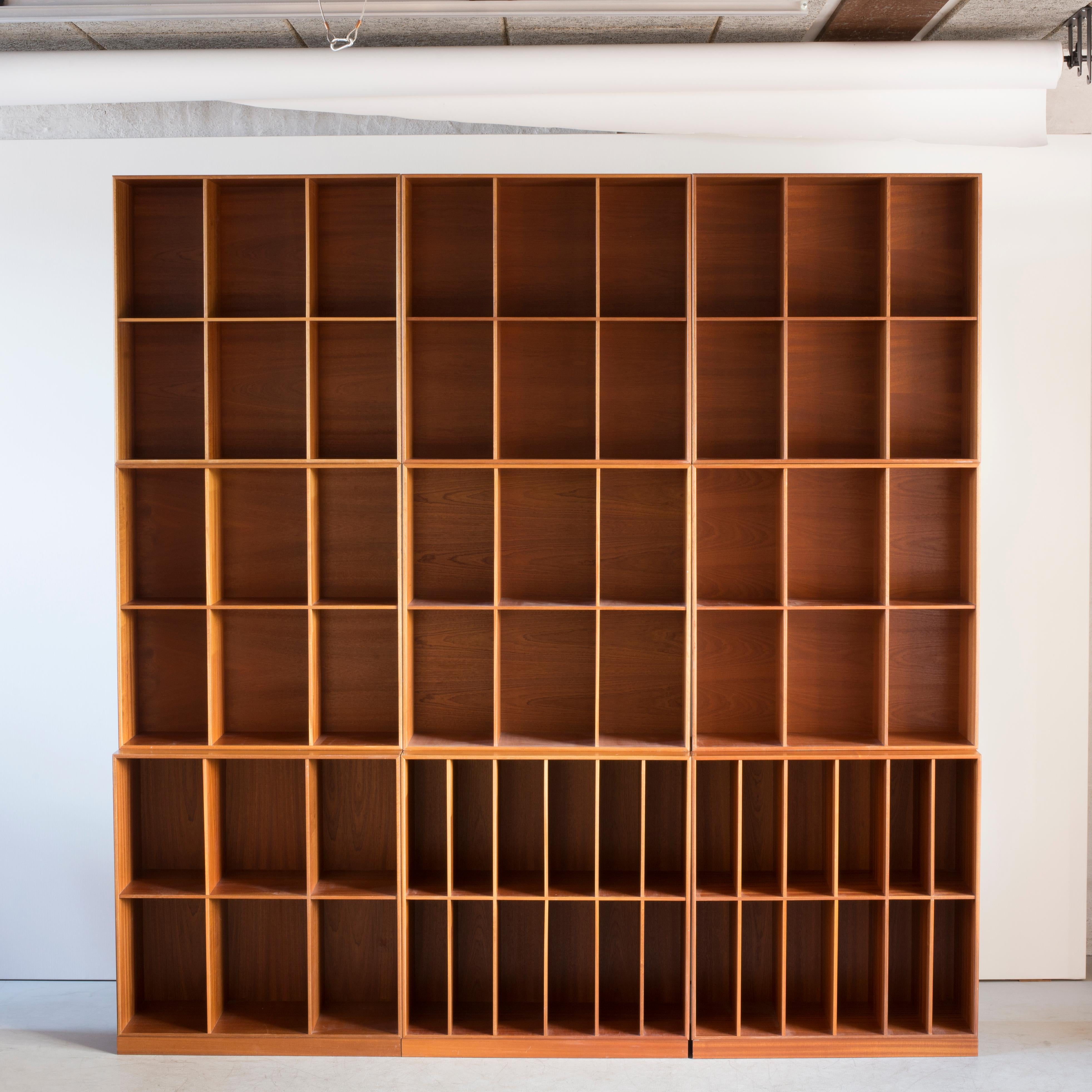 Mogens Koch wall unit of mahogany. Two bookcases with removable inlays. Executed by Rud Rasmussen.

Reverse with paper labels ‘RUD. RASMUSSENS/SNEDKERIER/KØBENHAVN/DENMARK.