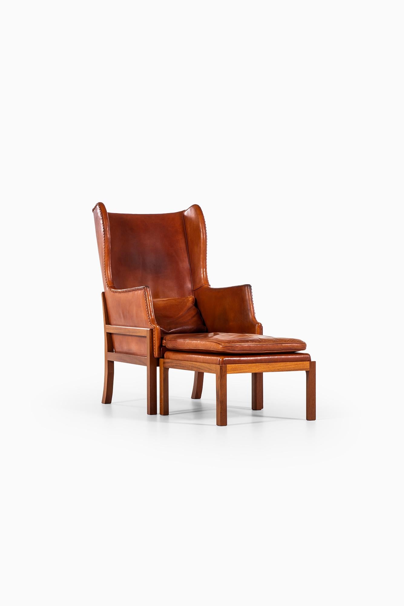 Mid-20th Century Mogens Koch Wing-Back Lounge Chair with Stool by Cabinetmaker Rud Rasmussen