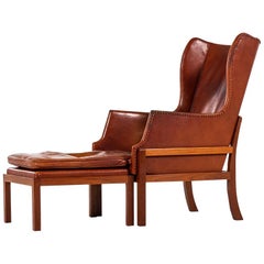Mogens Koch Wing-Back Lounge Chair with Stool by Cabinetmaker Rud Rasmussen