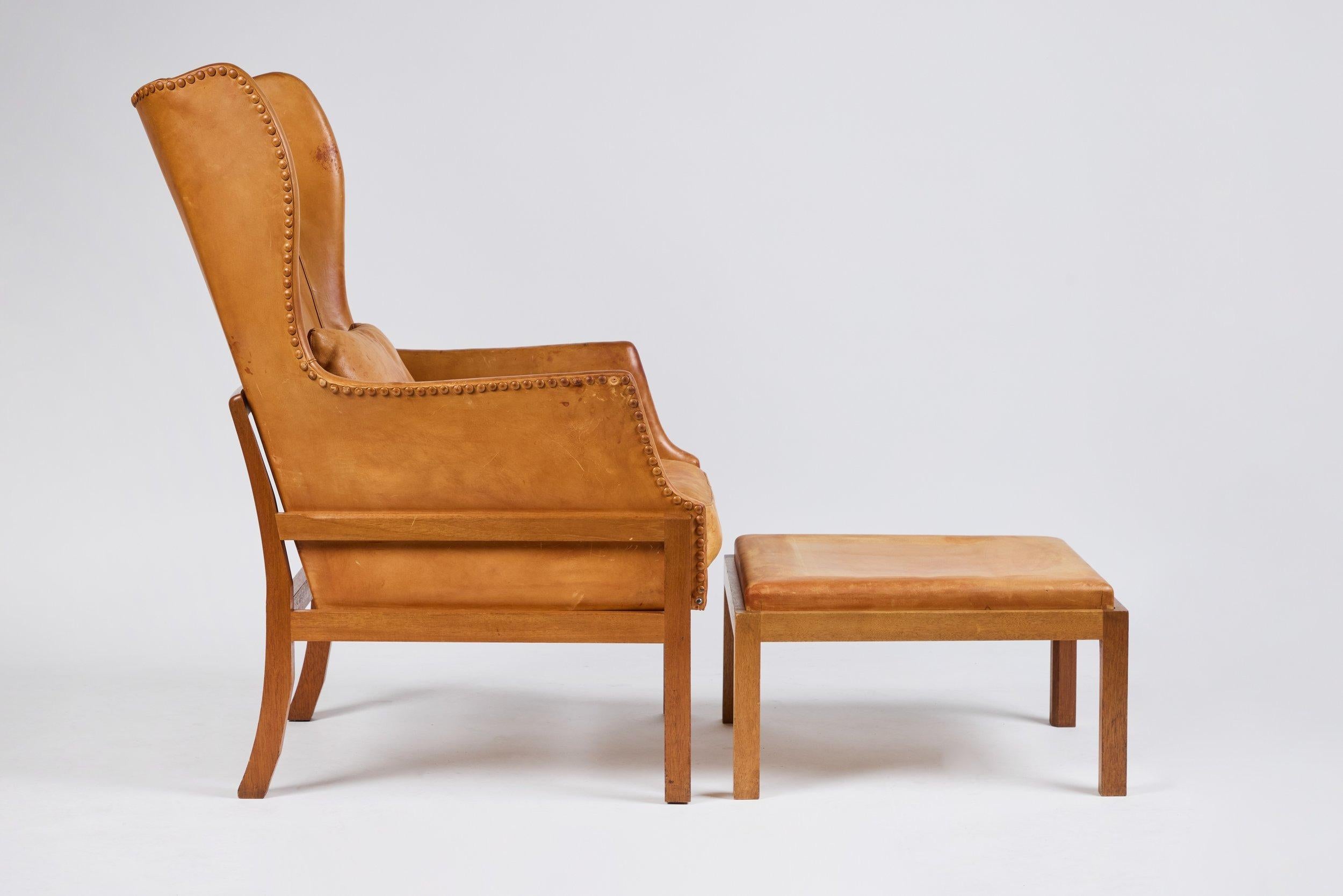 Mogens Koch Wingback Chairs and Ottomans For Sale 11