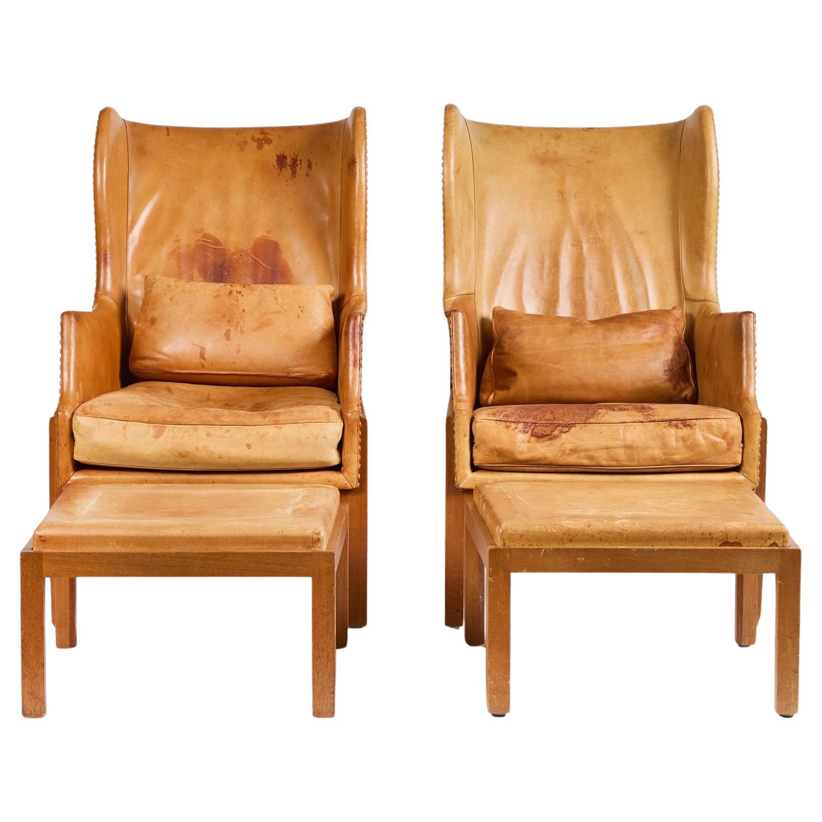 Mogens Koch Wingback Chairs and Ottomans