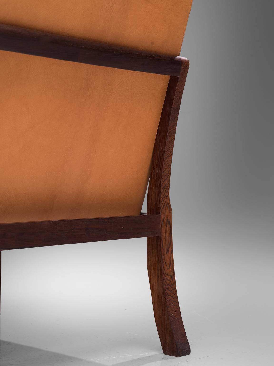 20th Century Mogens Koch Wingback Chair and Ottoman in Dark Mahogany, Cognac Leather