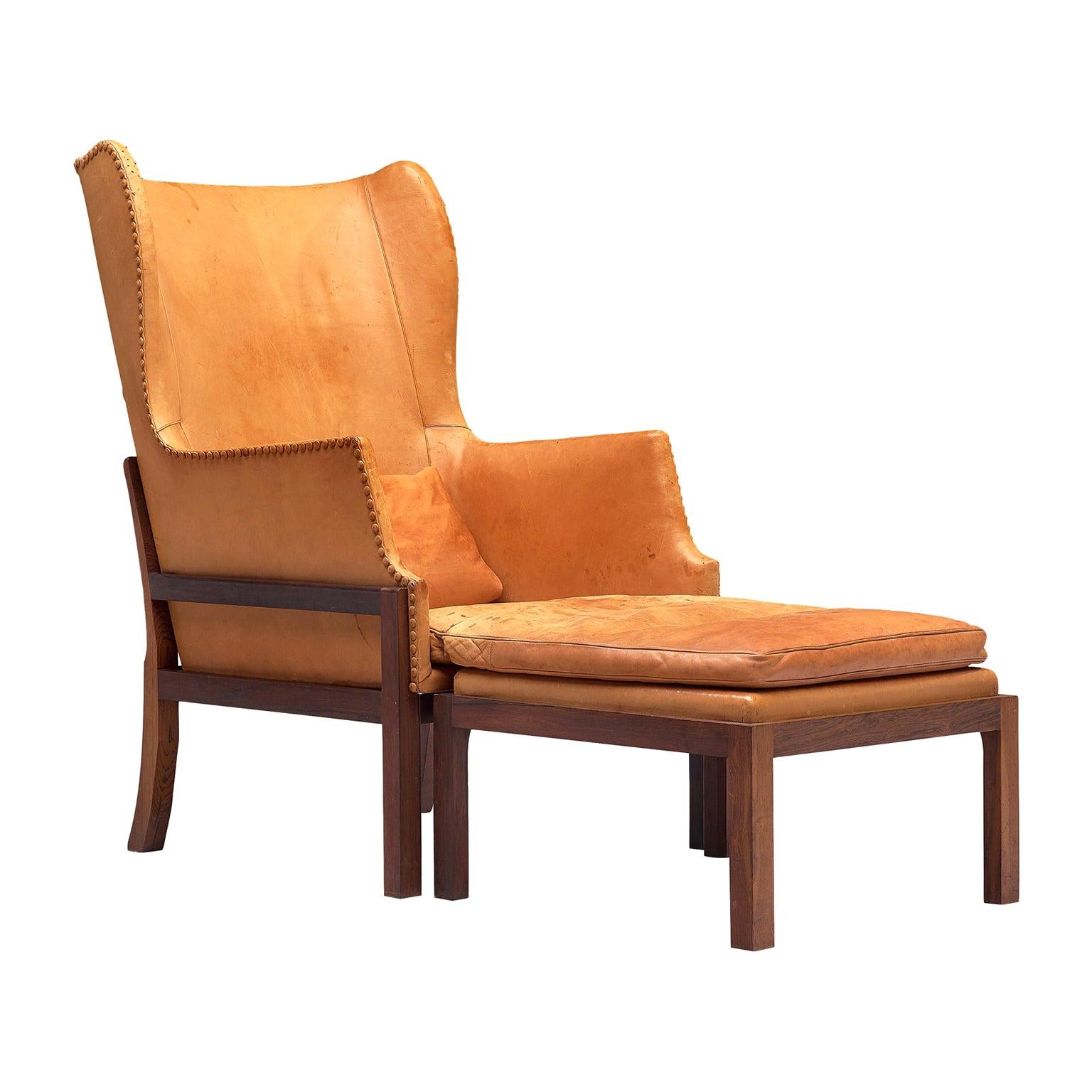 Mogens Koch Wingback Chair and Ottoman in Dark Mahogany, Cognac Leather