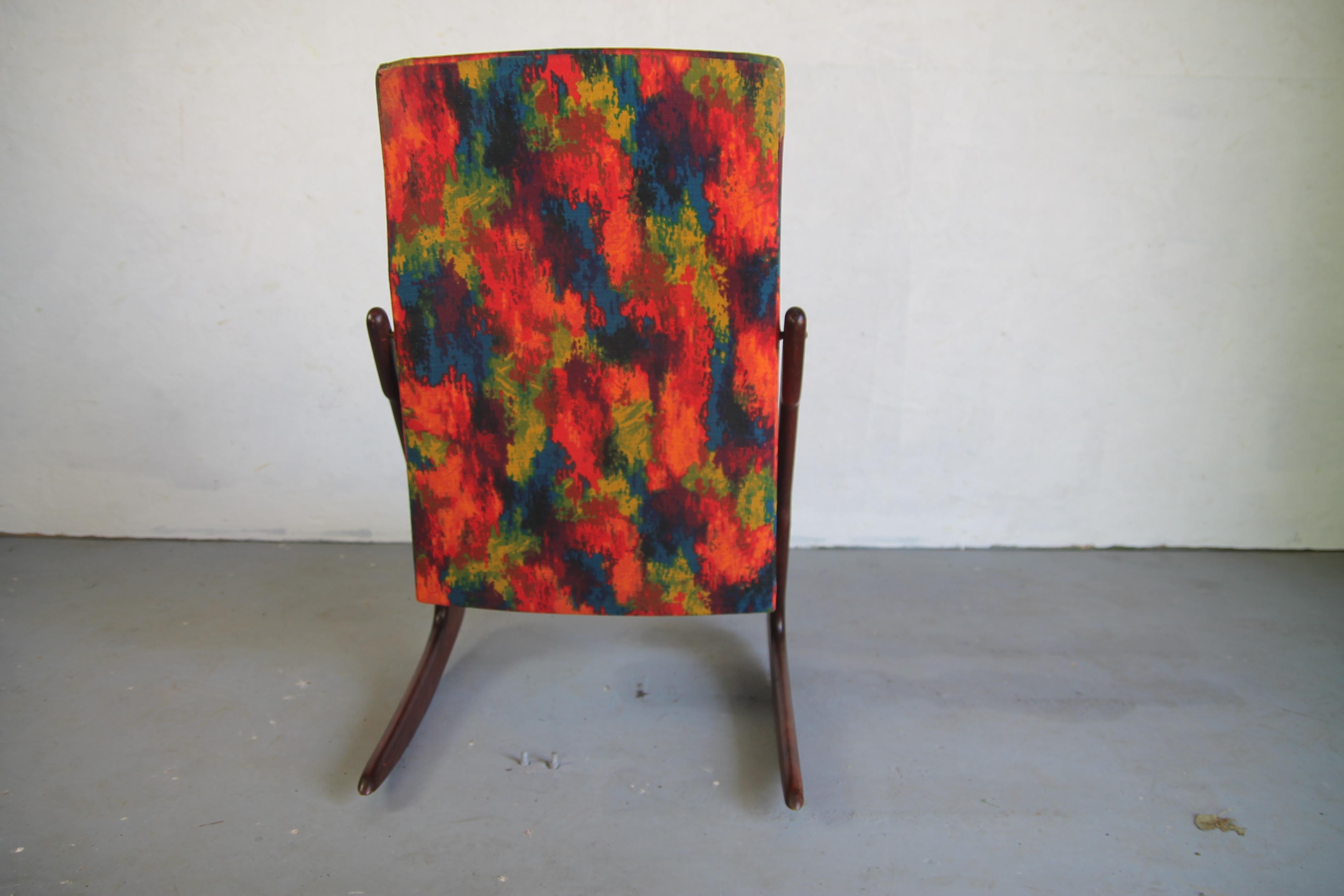 Wonderful and rare Mogens Kold rocker. All original finish, fabric and straps. Would recommend having new straps put on this great rocker. Its a true piece of art.