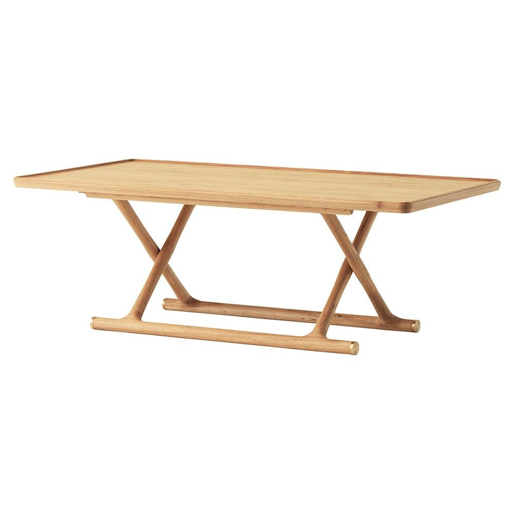 Mogens Lassen’s reissued coffee table from 1941 profiles the beauty of wood and brass while drawing inspiration from ancient Egypt: the foldaway design takes its cues from folding stools and beds found in Tutankhamen's tomb. Each table bares a brass