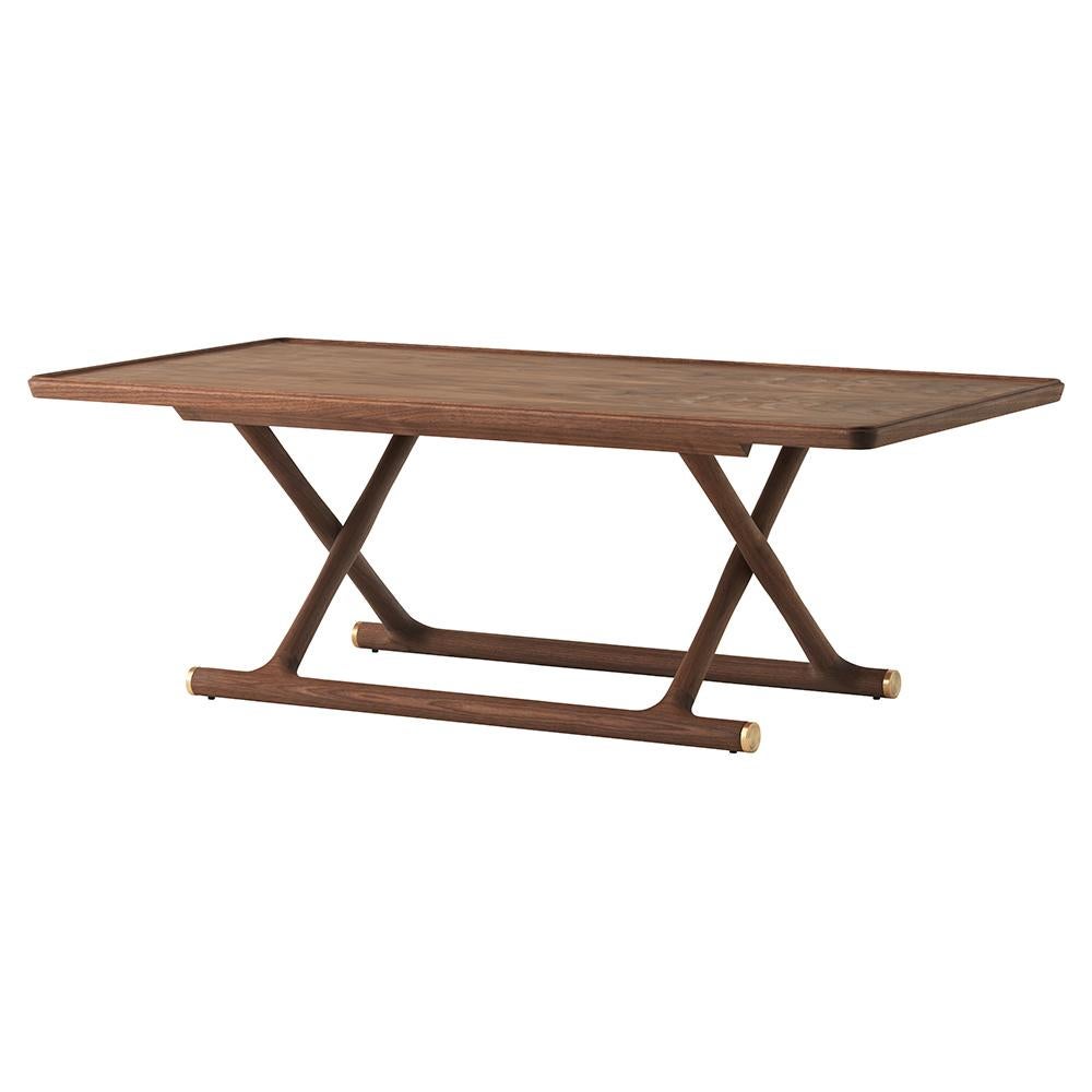 Mogens Lassen’s reissued coffee table from 1941 profiles the beauty of wood and brass while drawing inspiration from ancient Egypt: the foldaway design takes its cues from folding stools and beds found in Tutankhamen's tomb. Each table bares a brass