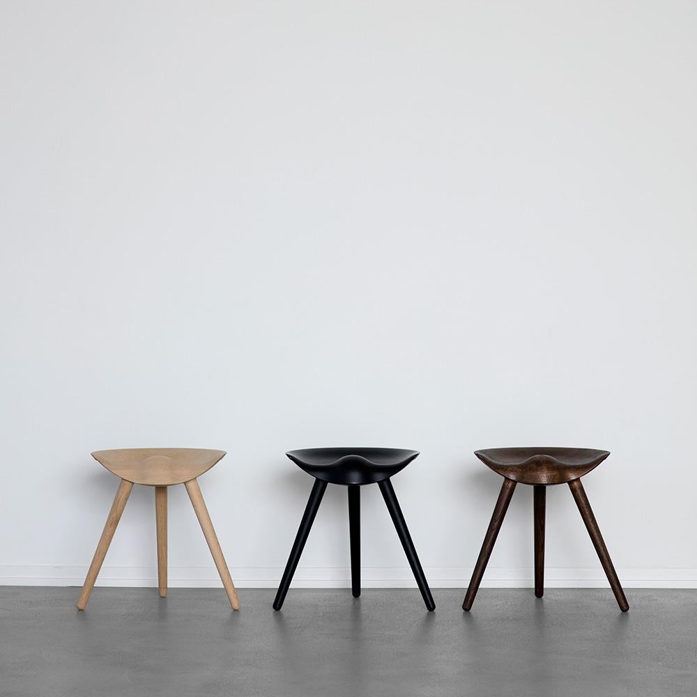 In 1942, Mogens Lassen designed the Stool ML42 as a piece for a furniture exhibition held at the Danish Museum of Decorative Art. Drawing inspiration from the practical stools traditionally used by shoemakers, Lassen reinterpreted their simple