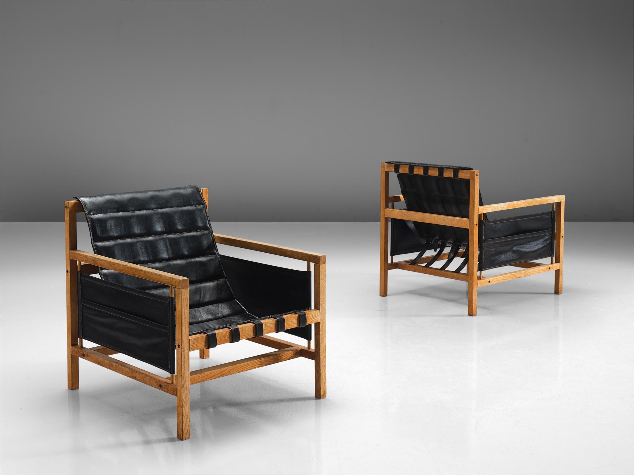 Mogens Plum and Kay Ingemann Iversen for Poul Hundevad, lounge chairs 'PH81', beech, black leather, Denmark, circa 1965

This pair of comfortable Danish armchairs is designed by Mogens Plum and Kay Ingemann Iversen. A cubic frame in blond beech