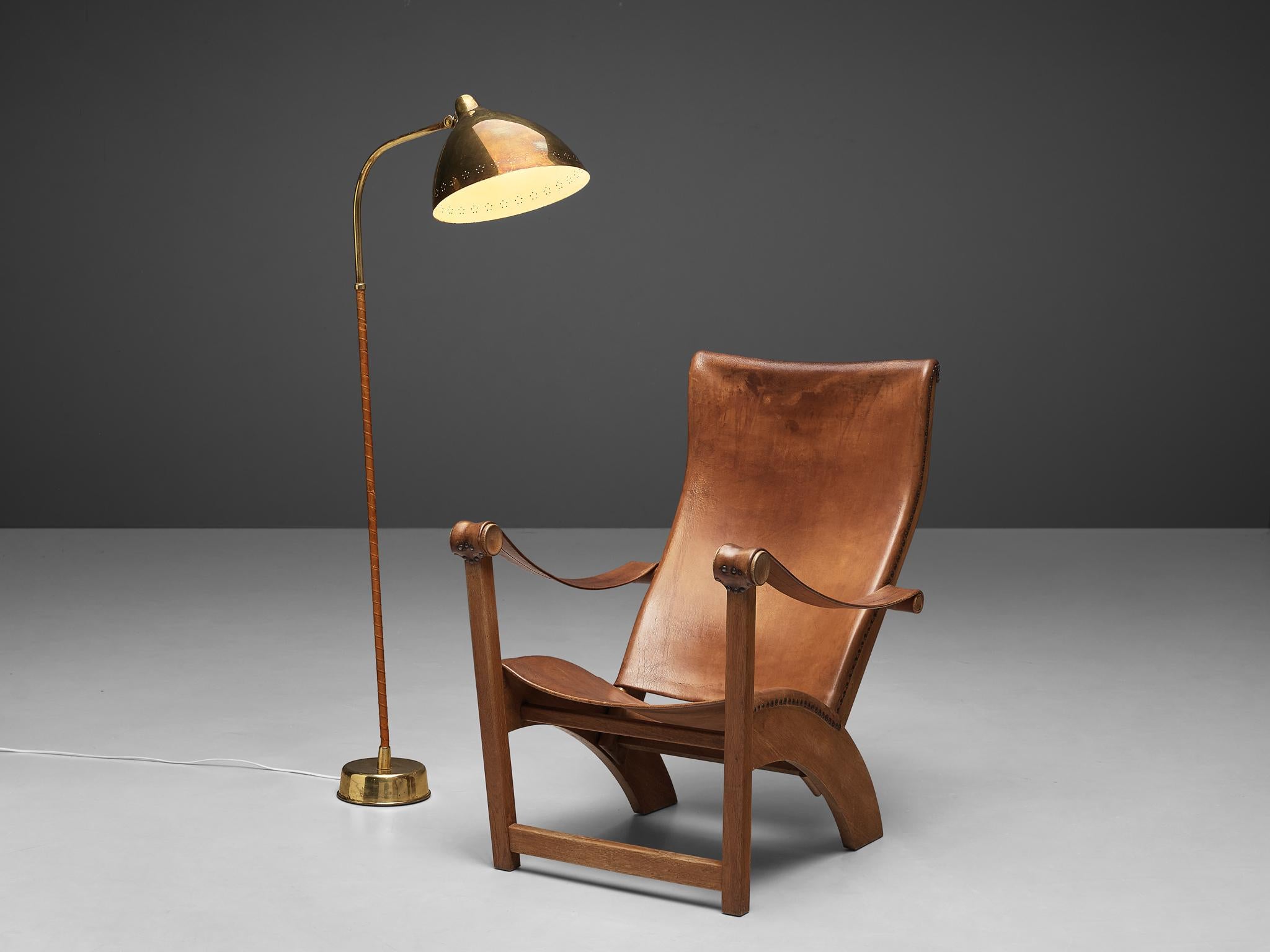 Mogens Voltelen for cabinetmaker Niels Vodder, lounge chair model 'Københavnerstolen', beech, cognac leather, brass, Denmark, 1936
This ‘Copenhagen’ lounge chair is designed by Mogens Voltelen. This is an early edition in which the armrests are