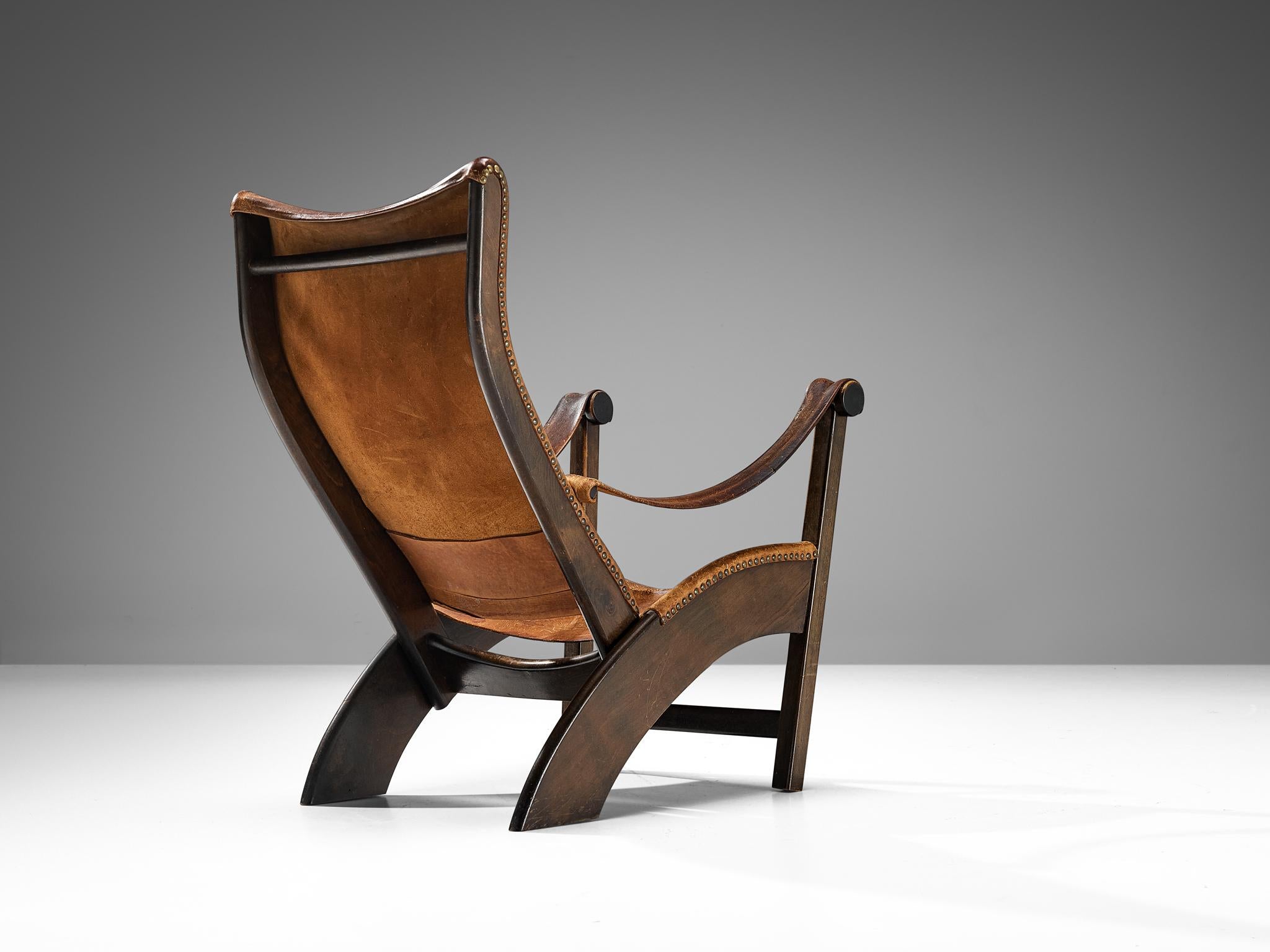 Mogens Voltelen pour Niels Vodder, chaise longue modèle 'Copenhagen', hêtre, cuir patiné, laiton, Danemark, design 1936

La chaise longue 