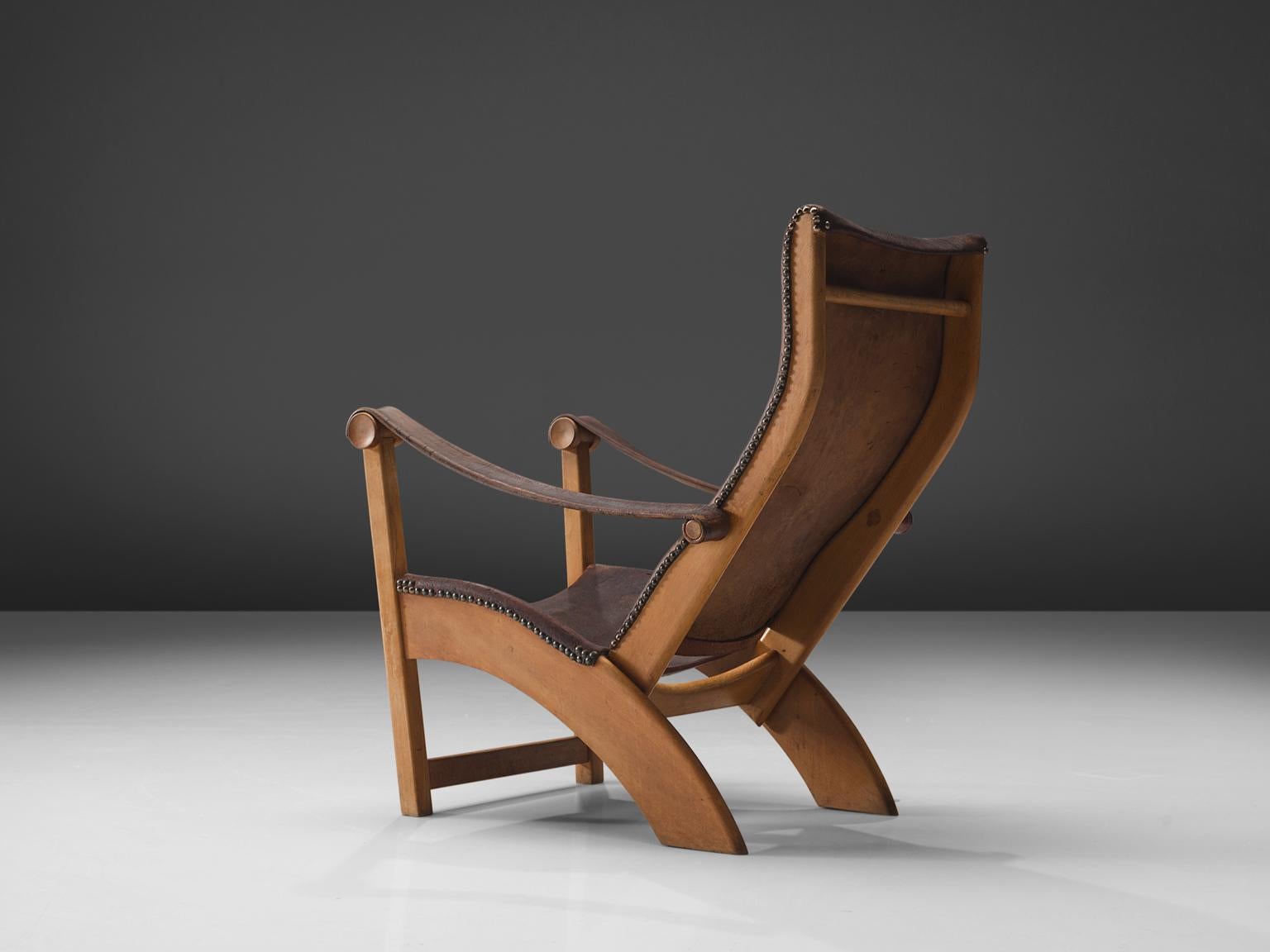 Mogens Voltelen for Niels Vodder, lounge chair model ‘Copenhagen', beech, leather, brass, Denmark, 1936

The ‘Copenhagen’ lounge chair was designed by Mogens Voltelen in 1936. The chair shows beautiful lines in the aged beech. Especially the