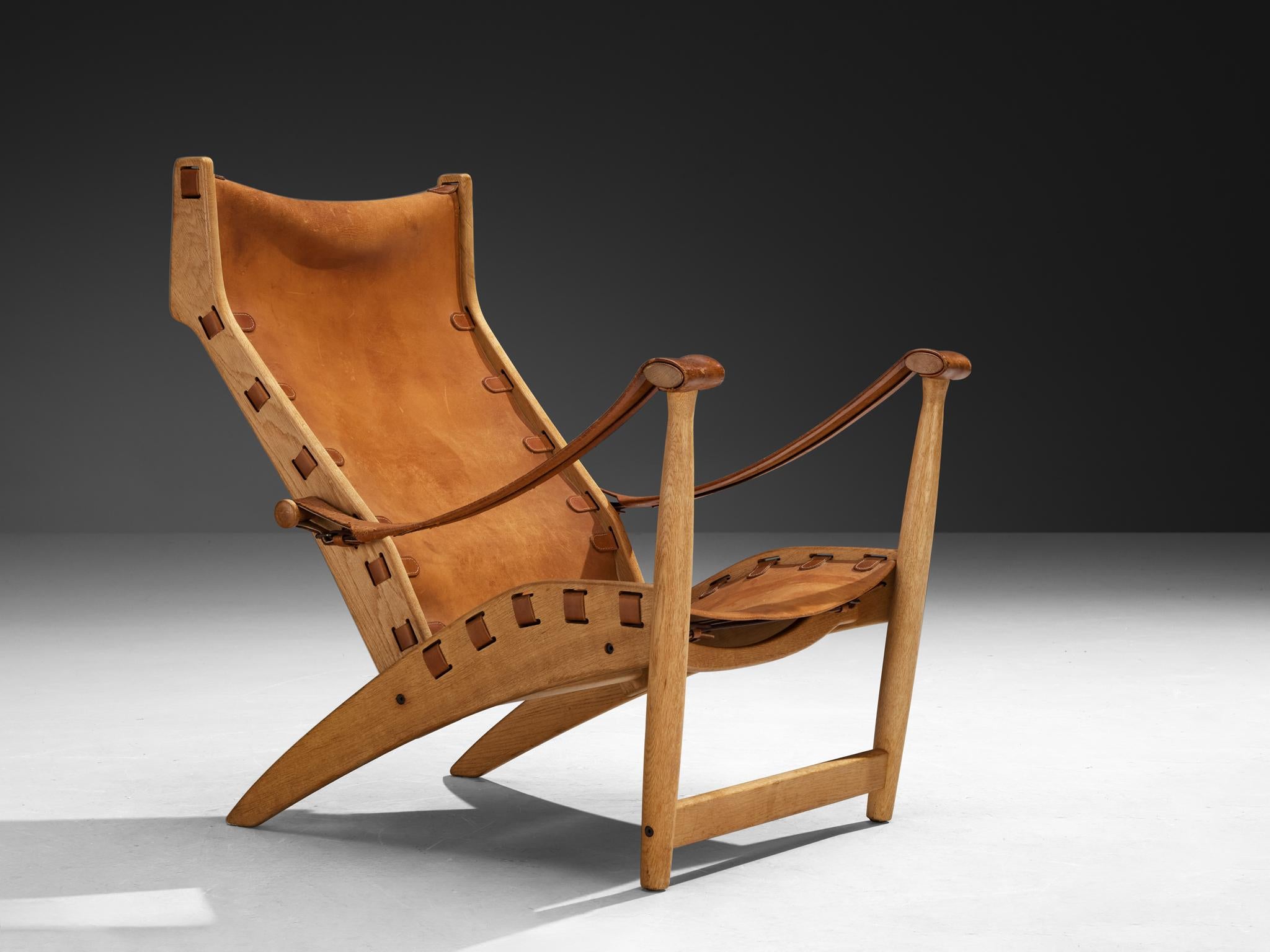 Mogens Voltelen für Niels Vodder, Sessel 'Copenhagen II', Modell 'MV60', Eiche, Leder, Dänemark, Entwurf 1960, hergestellt in den 1960er/70er Jahren

Der MV60 Lounge Chair, auch bekannt als Copenhagen II, ist ein seltener und raffinierter Entwurf