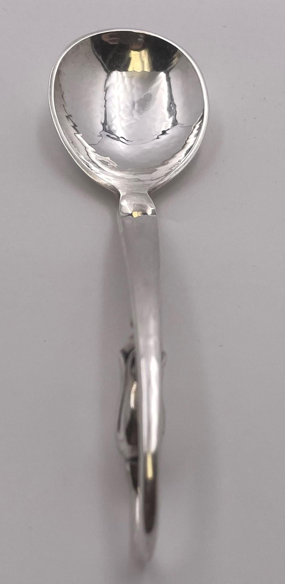 O. Mogensen sterling silver hand-hammered jam serving spoon in a style similar to the Blossom pattern by Georg Jensen and in pattern number 35. It measures 5 1/4'' in length, weighs 1 troy ounce, and bears hallmarks as shown.

Please feel free to