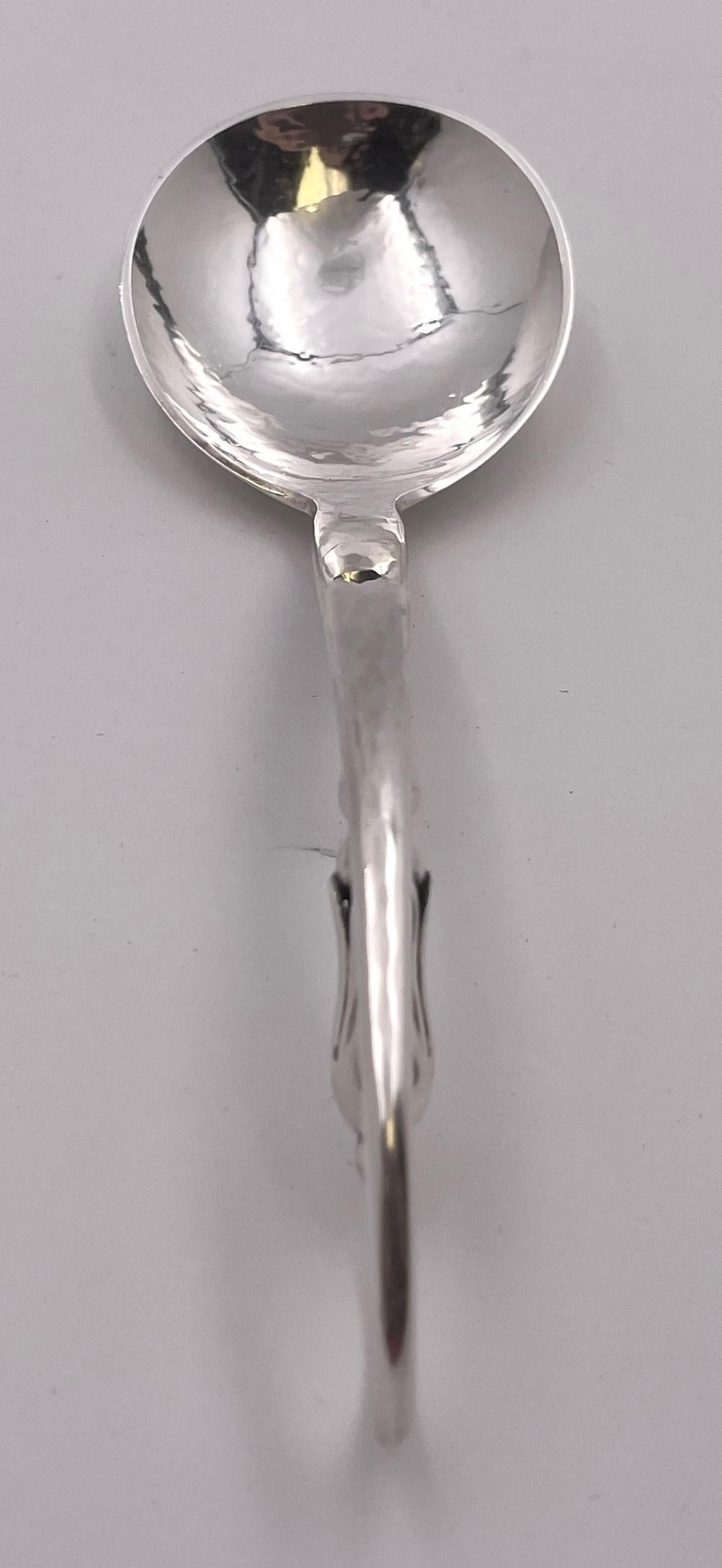 O. Mogensen sterling silver hand-hammered serving ladle spoon in a style similar to the Blossom pattern by Georg Jensen. It measures 6 1/3'' in length, weighs 1.6 troy ounces, and bears hallmarks as shown.

Please feel free to ask us any questions,
