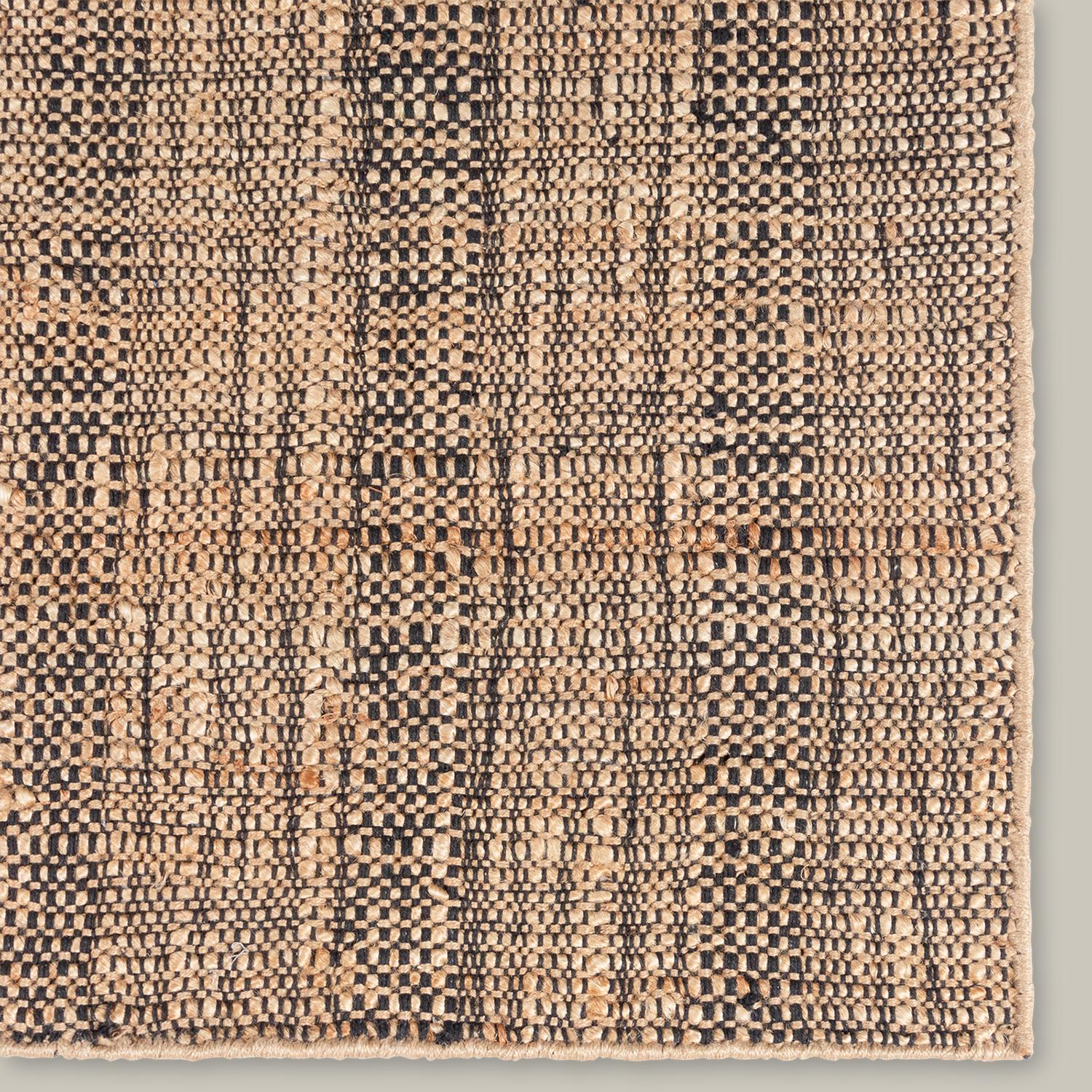 The quality of the line pattern sets the Moghar Collection apart. A handwoven jute flatweave, the subtle gradations of color work together to create an elevated basic. Built for layering, the wonky lines and irregular texture all have a very