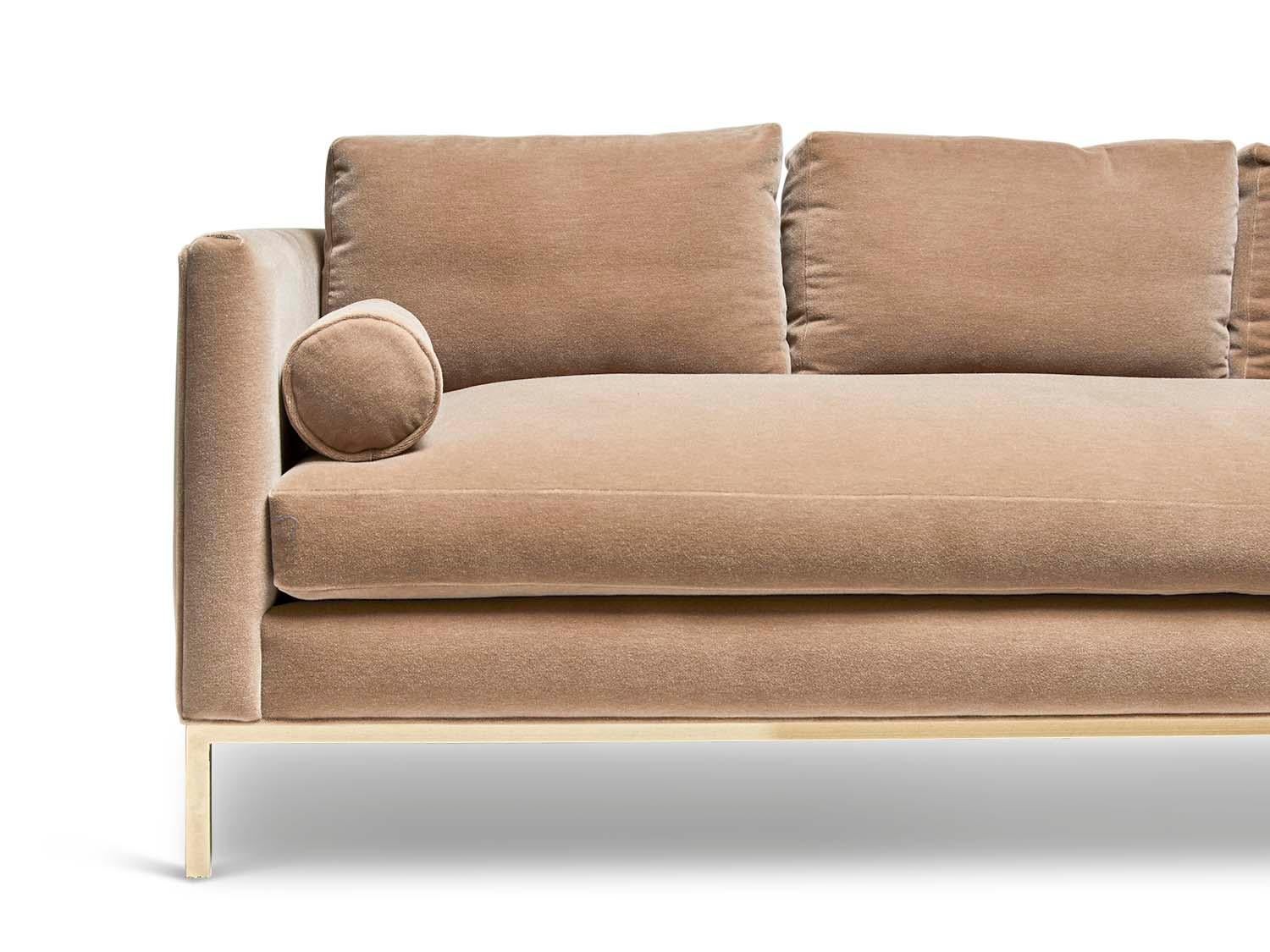 The curved back sofa is a tuxedo style sofa with curved corners and features a single down-wrapped, seat cushion with 3 down-wrapped, removable back cushions and two bolsters. The base can be made in American walnut, white oak or metal. Shown here