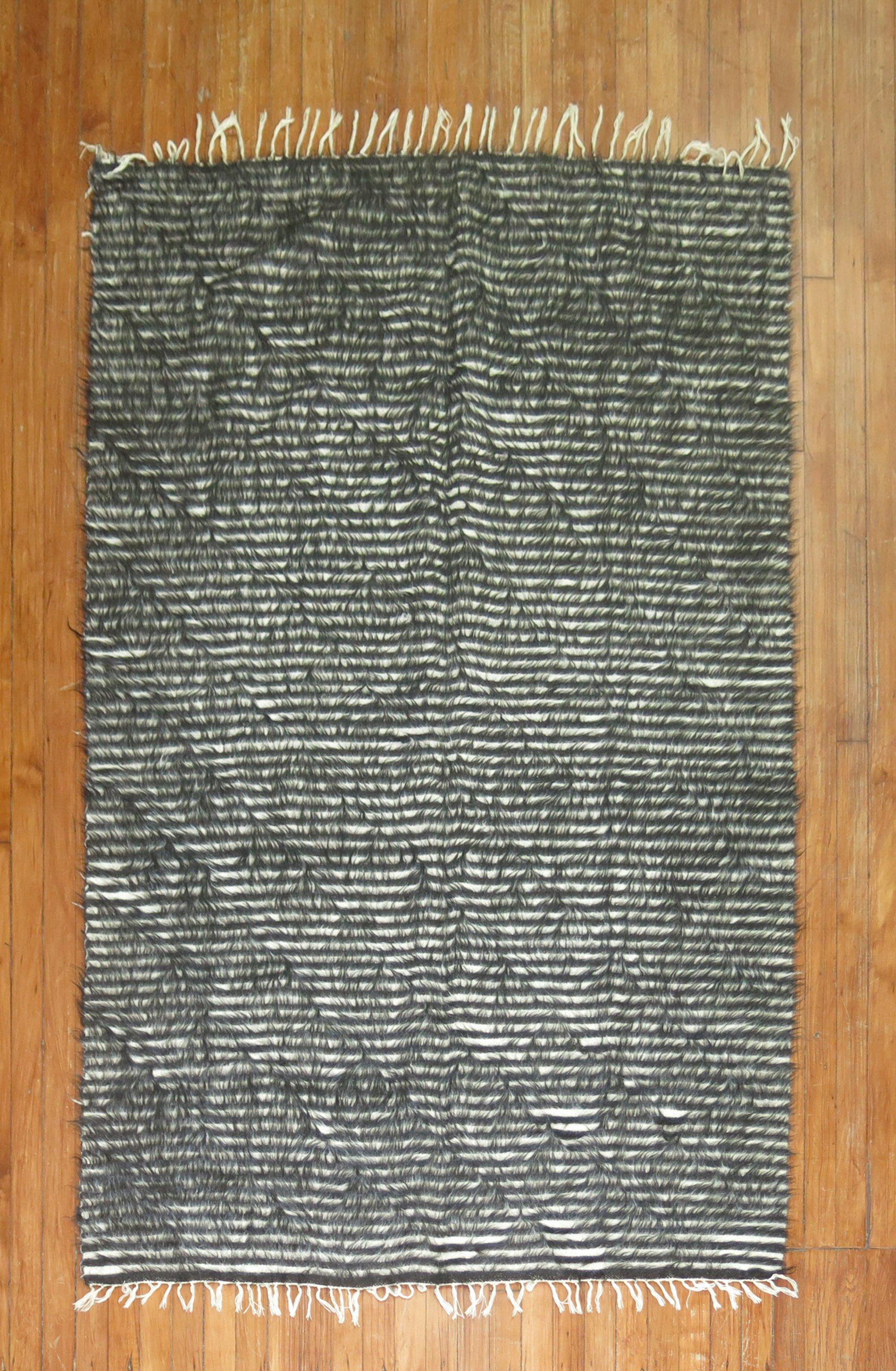 Vintage Mohair rug with a striped design in black and white

Measures: 4'3'' x 6'7''.