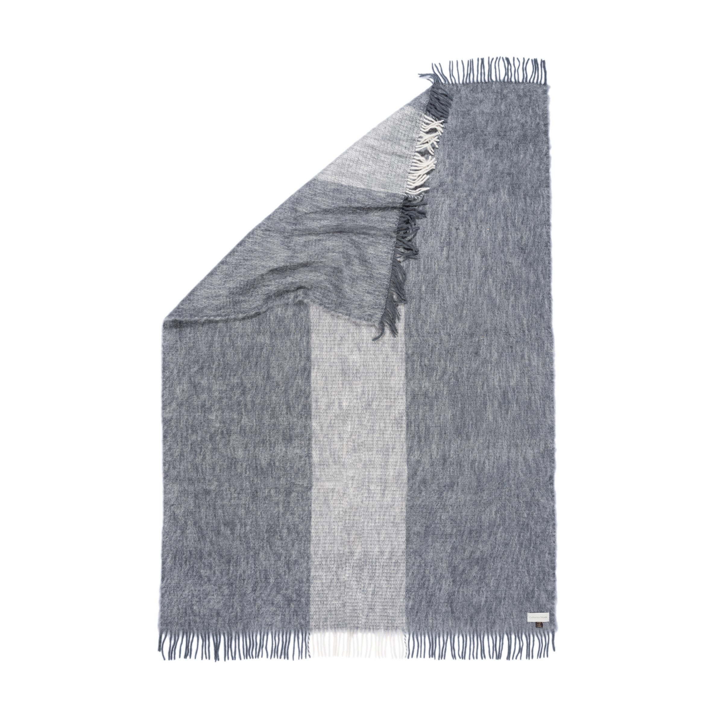 Designed in Berlin by Catharina Mende, woven of 50% mohair, 48% Wool, 2% polyamide in Spain: This grey flattering and warming fluffy mohair blanket is the perfect companion for every season - an indispensable favorite for the home or the