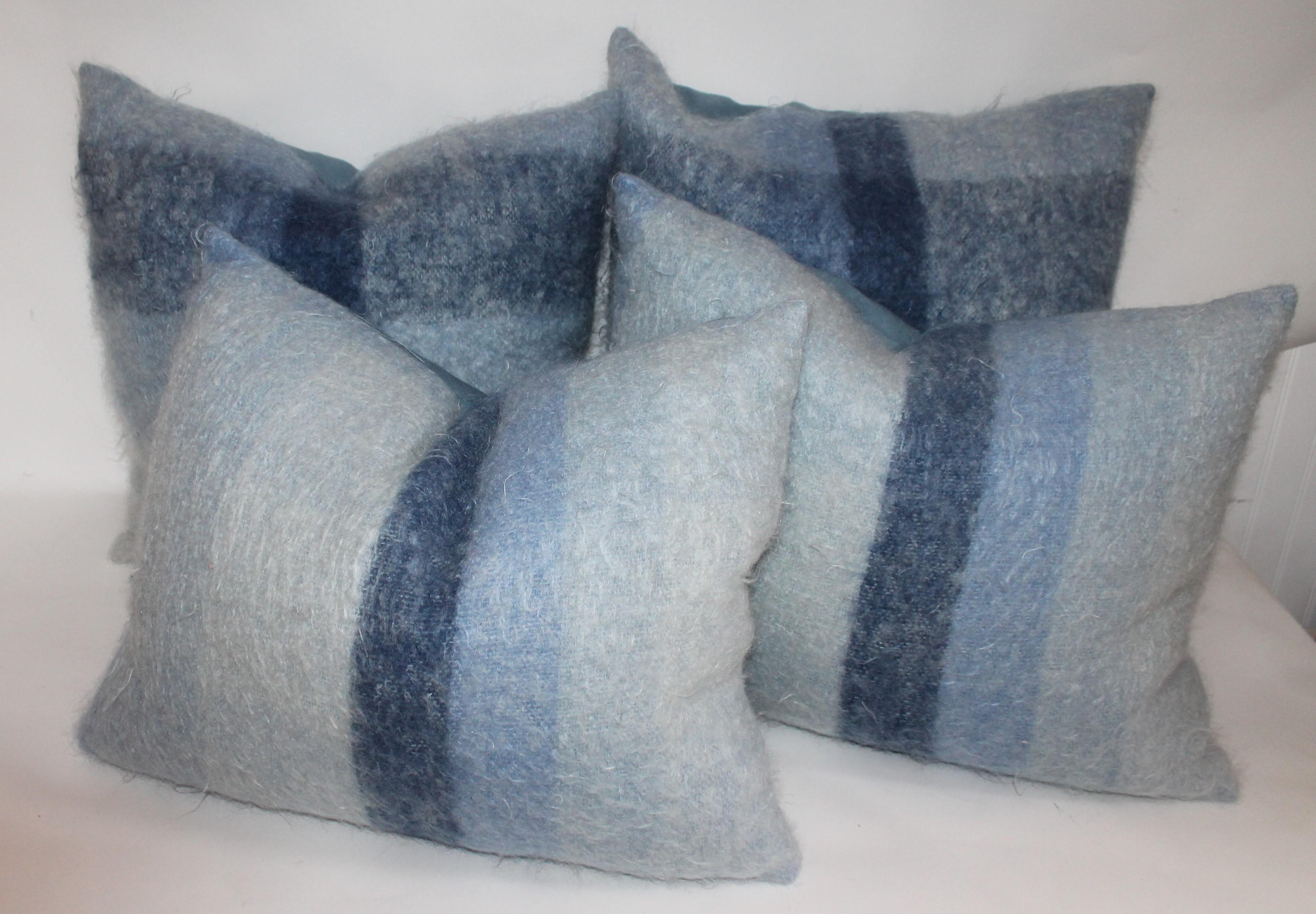 These two pairs of soft mohair or lambs wool pillows are in fine condition and have robin egg blue cotton linen backings. Sold as a collection of two pairs.

Pillows measure 
20 high x 20 wide
20 x 20
18 high x 21 wide.