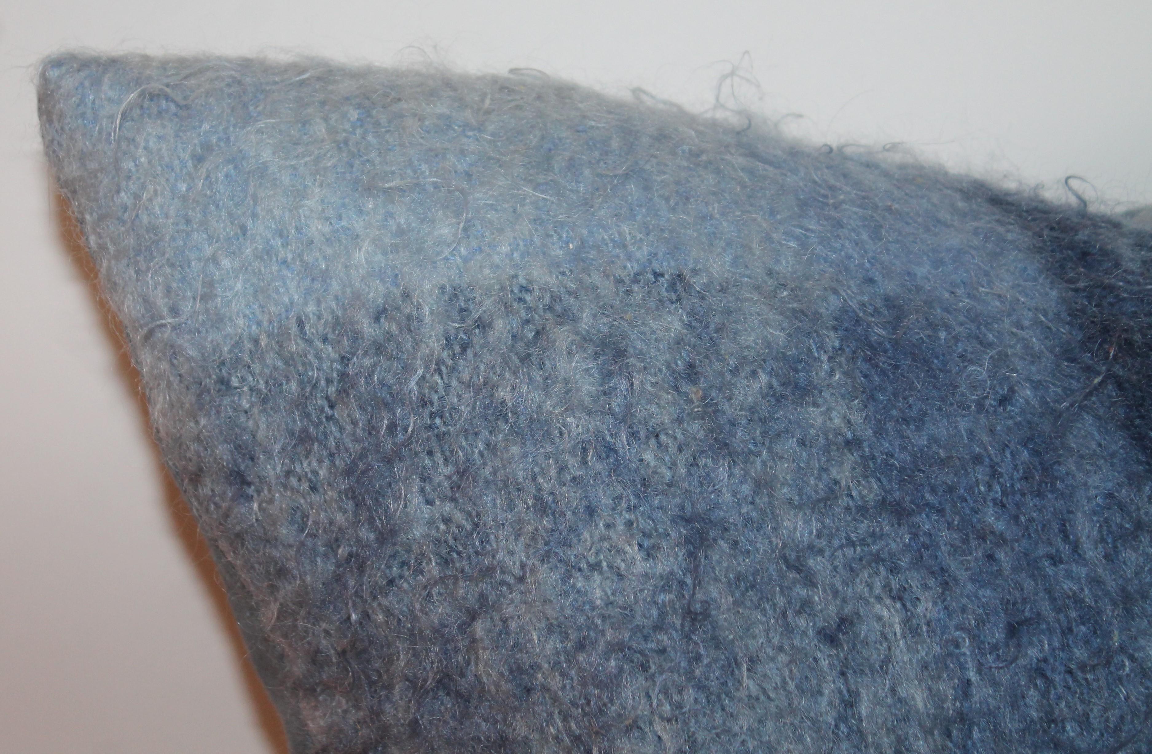 These mohair blanket pillows are in fine condition with light to dark shades of blue. The backing is in light blue cotton linen. Sold in pairs.