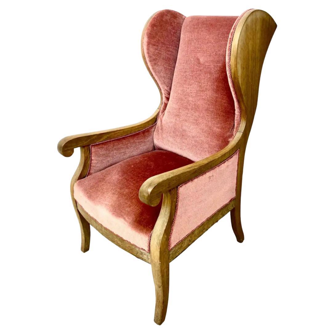 Frits Heningsen mahogany and Mohair high-backed wingback armchair, 1940s, Denmark. Henningsen's furniture was handmade and his studio kept to a very traditional, labor-intensive method of production based in the traditions of the 19th century.