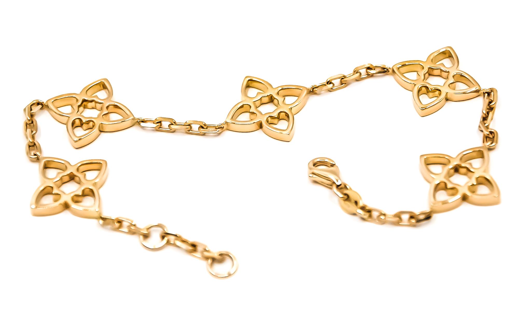 18kt solid yellow gold 5 motif bracelet by Mohamad Kamra from the Connected Hearts Collection.

Bracelet can be made in any wrist size.