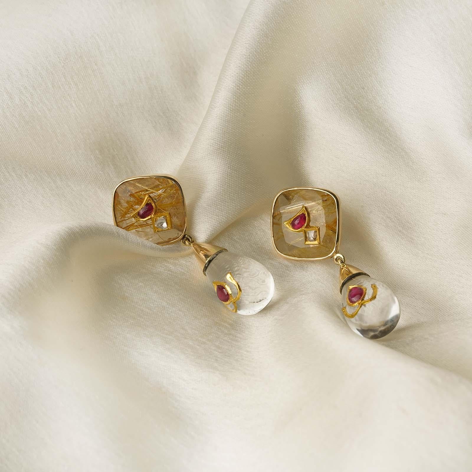 Gold(22K): 1.03g
Gold(14K): 4.79g
Uncut Diamonds/Vilandi/Polki: 0.12ct
Gemstones: Ruby, Rutile Quartz, Natural Crystal

Our unmistakable identity, our signature use of artisanal skills that come into play when working with authentic techniques is