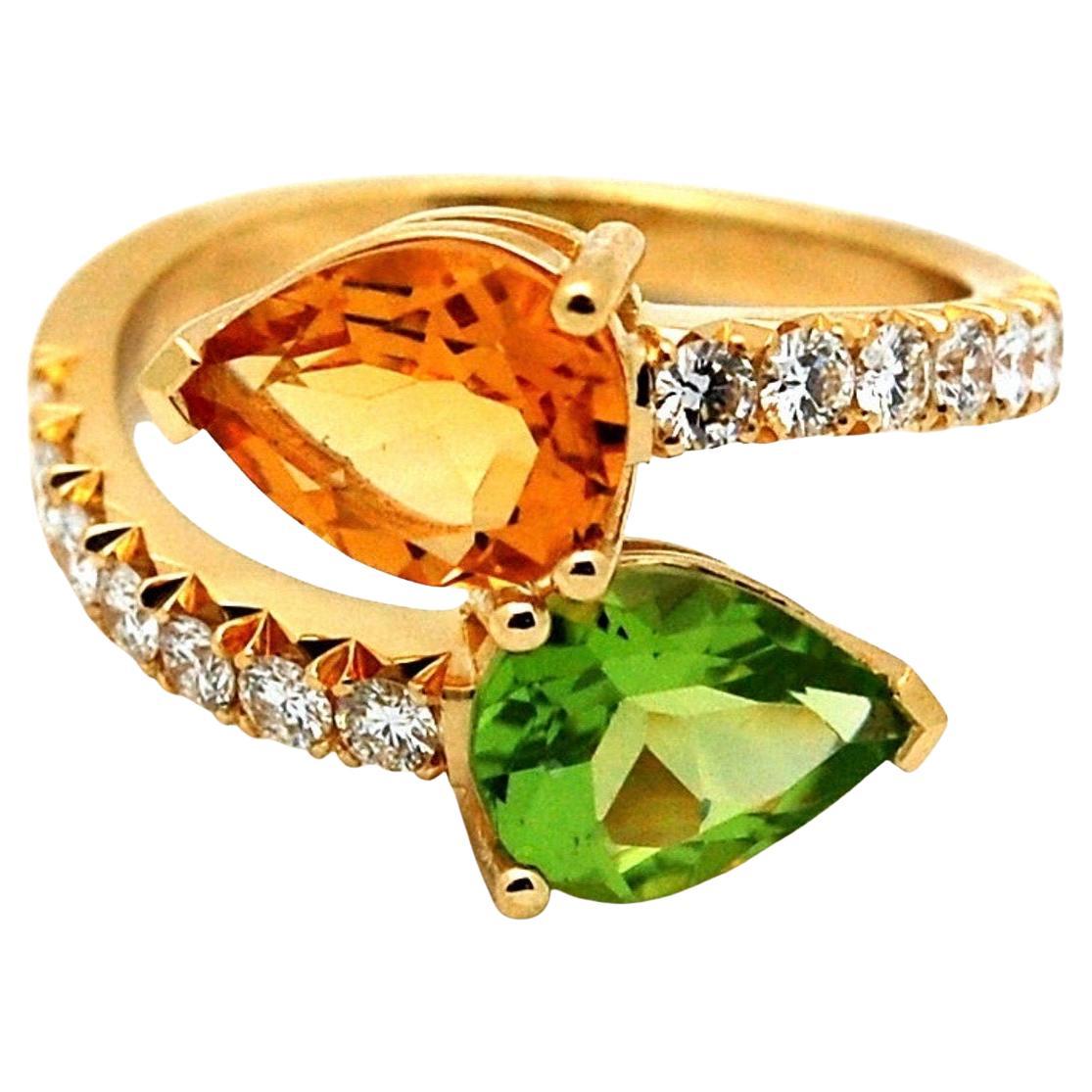 Stunning one of a kind moi et toi ring in 18KT yellow gold, size 6 can be re-sized.
The ring comes with rare fishtail diamond setting on sides with VS diamonds E-F color and fine quality citrine and peridot. Its a very bright sparkly ring that