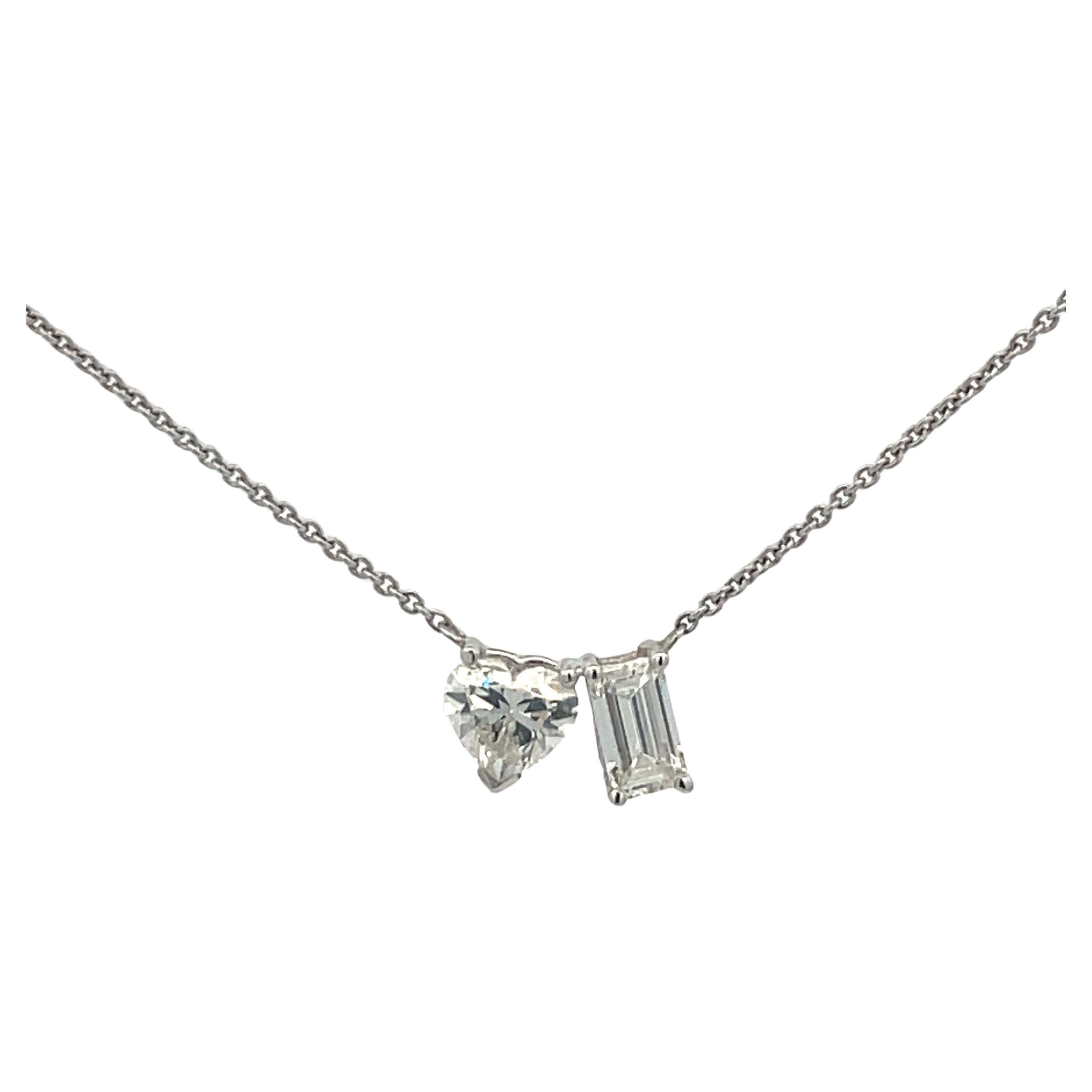 Moi Et Toi pendant necklace featuring GIA Certified stones, one Heart shape diamond, 0.80 Carats G SI2, and one Emerald Cut Diamond, 0.61 Carats G VS2, in 14 Karat White Gold. 