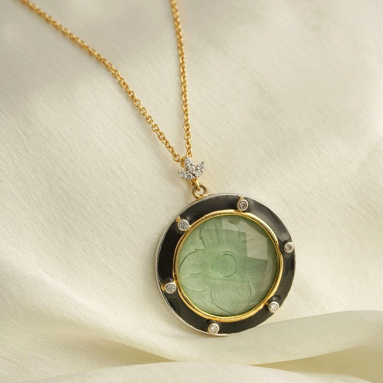 Gold(18K) : 3.70g
Gold(14K) : 3.81g
Diamonds : (VS clarity & H-I colour) : (Brilliant cut) : 0.12ct
Gemstone : Creative Tourmaline
Silver Alloy

Simple yet sophisticated, the Rory Gilmore pendant epitomizes style, grace and elegance, dare we say,