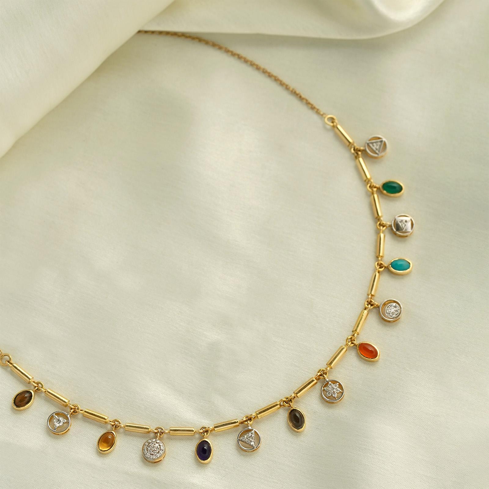 Gold(18K) : 1.98g
Gold(14K) : 10.15g
Diamonds : (VS clarity & H-I colour) : (Brilliant cut ) : 0.54ct
Gemstones : Smokey Quartz, Green Onyx, Turquoise, Amethyst, Citrine, Tigers Eye, Red Onyx

This elegant beauty is meticulously handcrafted with