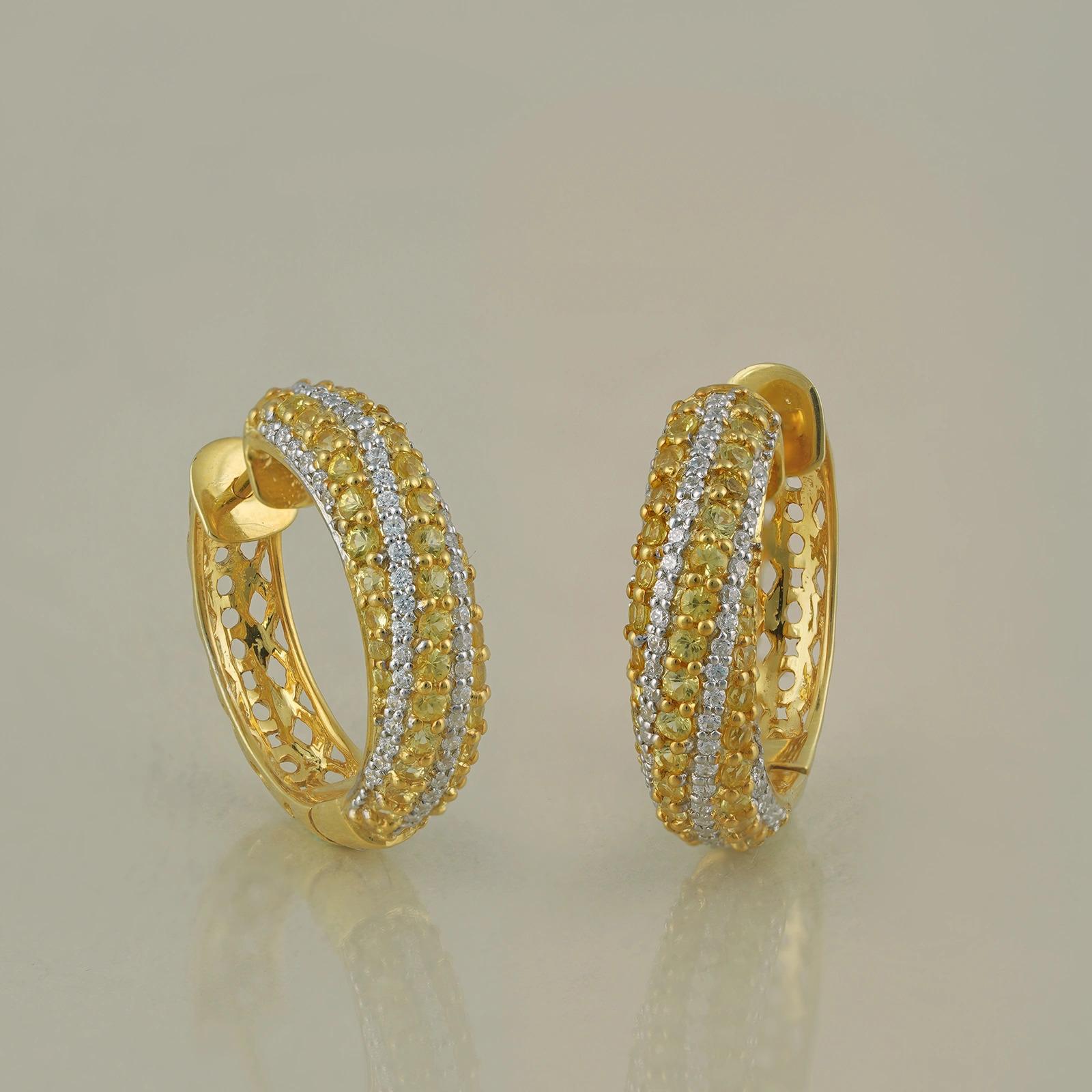 Gold(14K) : 8.50g
Diamonds : (VS clarity & H-I colour) : (Brilliant cut ) : 0.62ct
Gemstone : Yellow Sapphire : 2.31ct

Yellow sapphires. Diamonds. Made in yellow gold.
<br />
<br />
Dainty and exquisite, these mini hoops are a perfect balance of