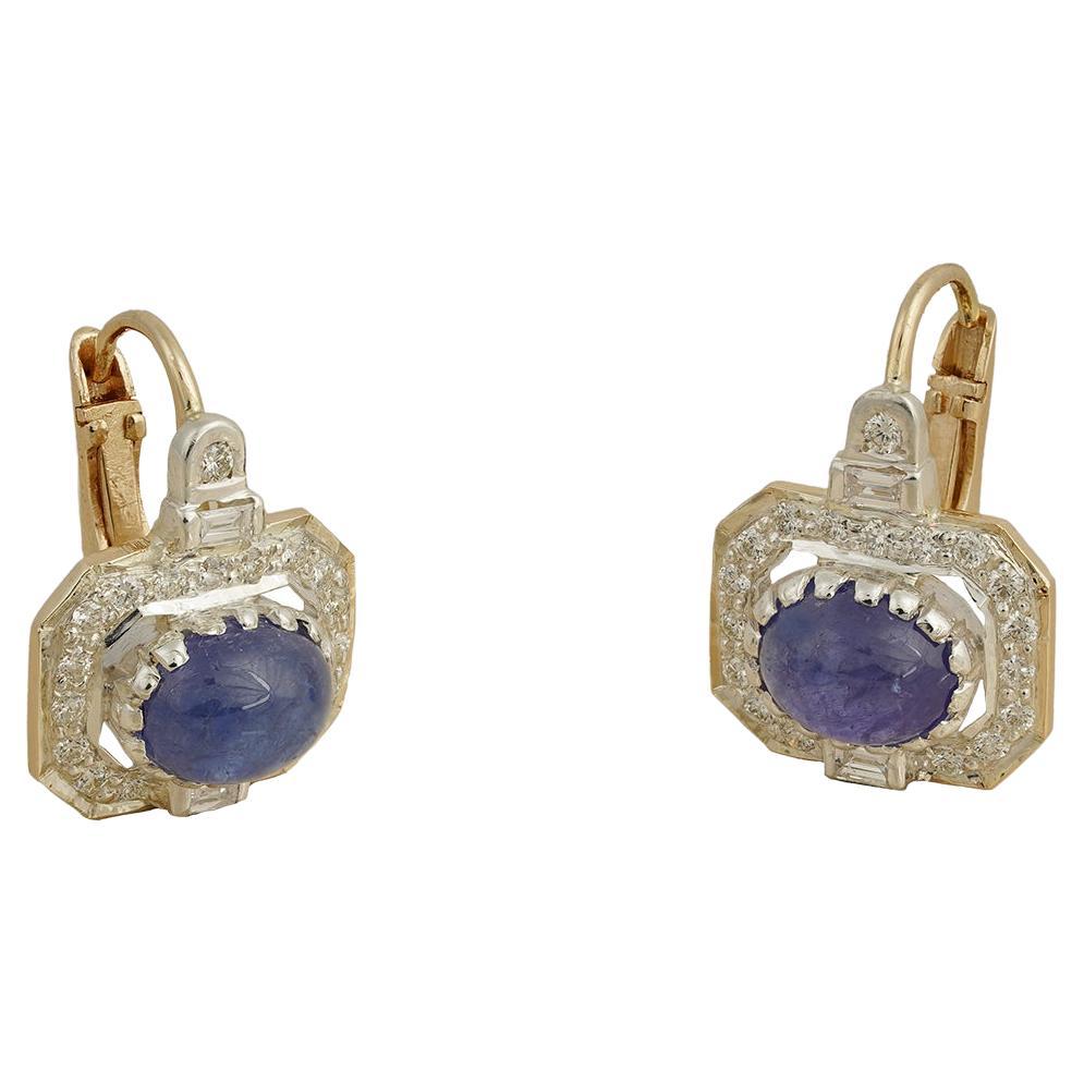 Gold(14K) : 3.6g
Diamonds : (VS clarity & H-I colour) : (Brilliant cut ) : 0.55ct : (Baguette diamond) : 0.20ct
Gemstone : Tanzanite
Silver Alloy

Our design ideology celebrates a pop of color. This limited edition earring is a perfect one at that!