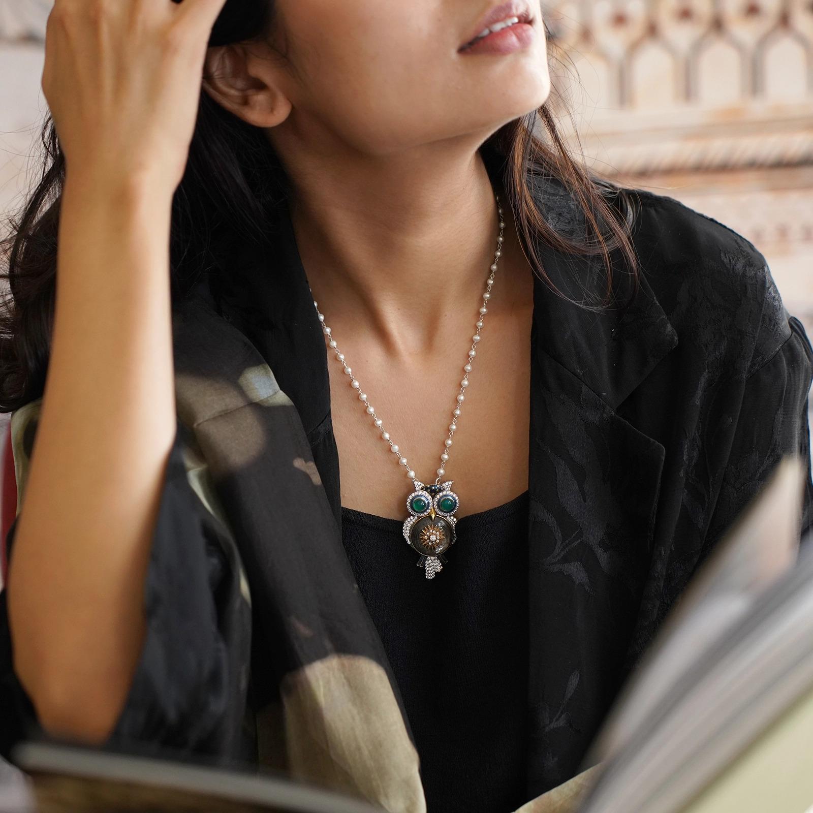 Gold(14K) : 6.0g
Diamonds : (SI clarity & H-I colour) : (Brilliant cut) : 0.55ct
Rose-cut Diamond : 2.20ct
Gemstone : Green Onyx, Mica 925 Silver
Other : Blue Enamel and Black Silk Thread

Diamonds. Green onyx. Mica. Blue enamel. Crafted in 925