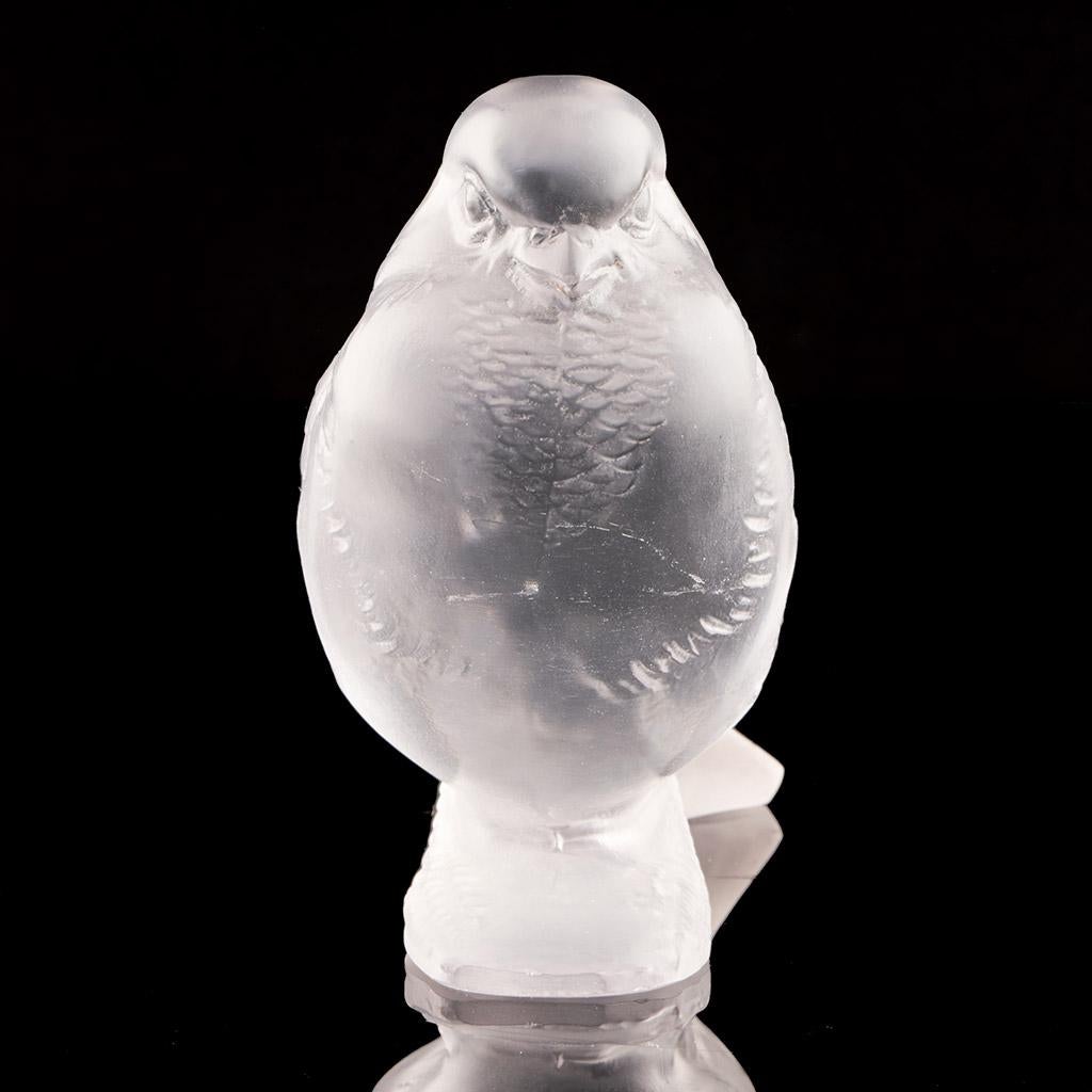 'Moineau Fier', an Art Deco glass paperweight. A proud sparrow in frosted glass set on an integral base. R Lalique France raised to underside. 

René Jules Lalique (French, 1860–1945) was a renowned jeweller and master glassmaker. As one of the